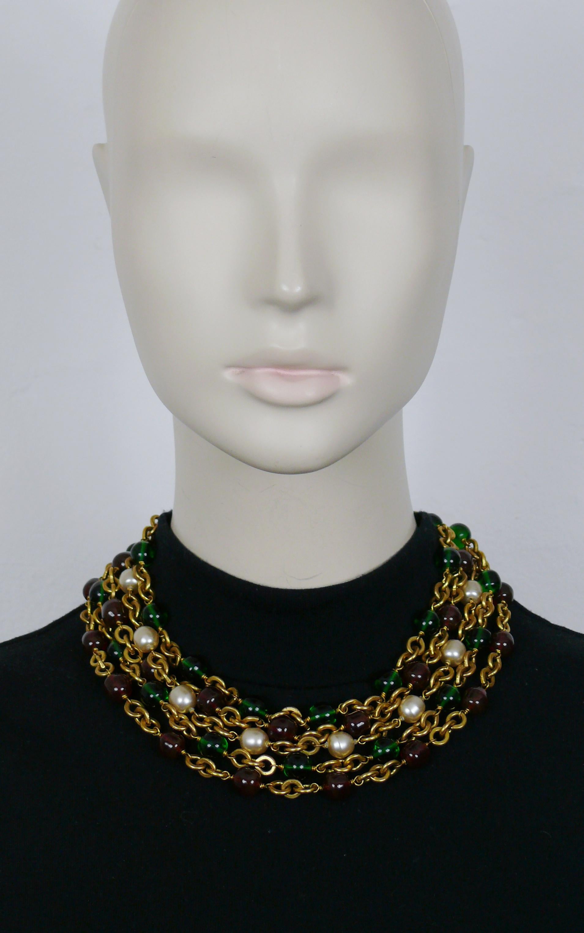 CHANEL by KARL LAGERFELD gold tone triple strand necklace featuring faux pearls and MAISON GRIPOIX green and red glass beads.

CHANEL jewelry creator director : VICTOIRE DE CASTELLANE.
Collection number 23 (year : 1988).

Hook clasp