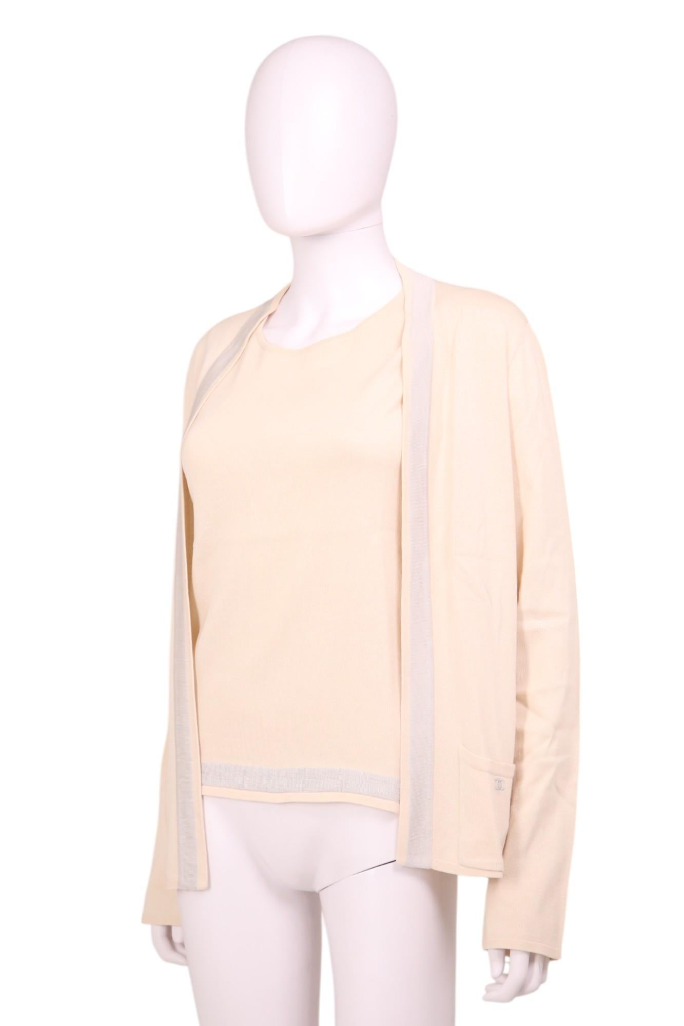 - Designed by Karl Lagerfield
- Spring Summer 2003
- Cream Knit Twinset
- Open-front cardigan with clean, minimalist lines
- Long sleeves with ribbed cuffs
- Hip-length
- Front pockets with grey 