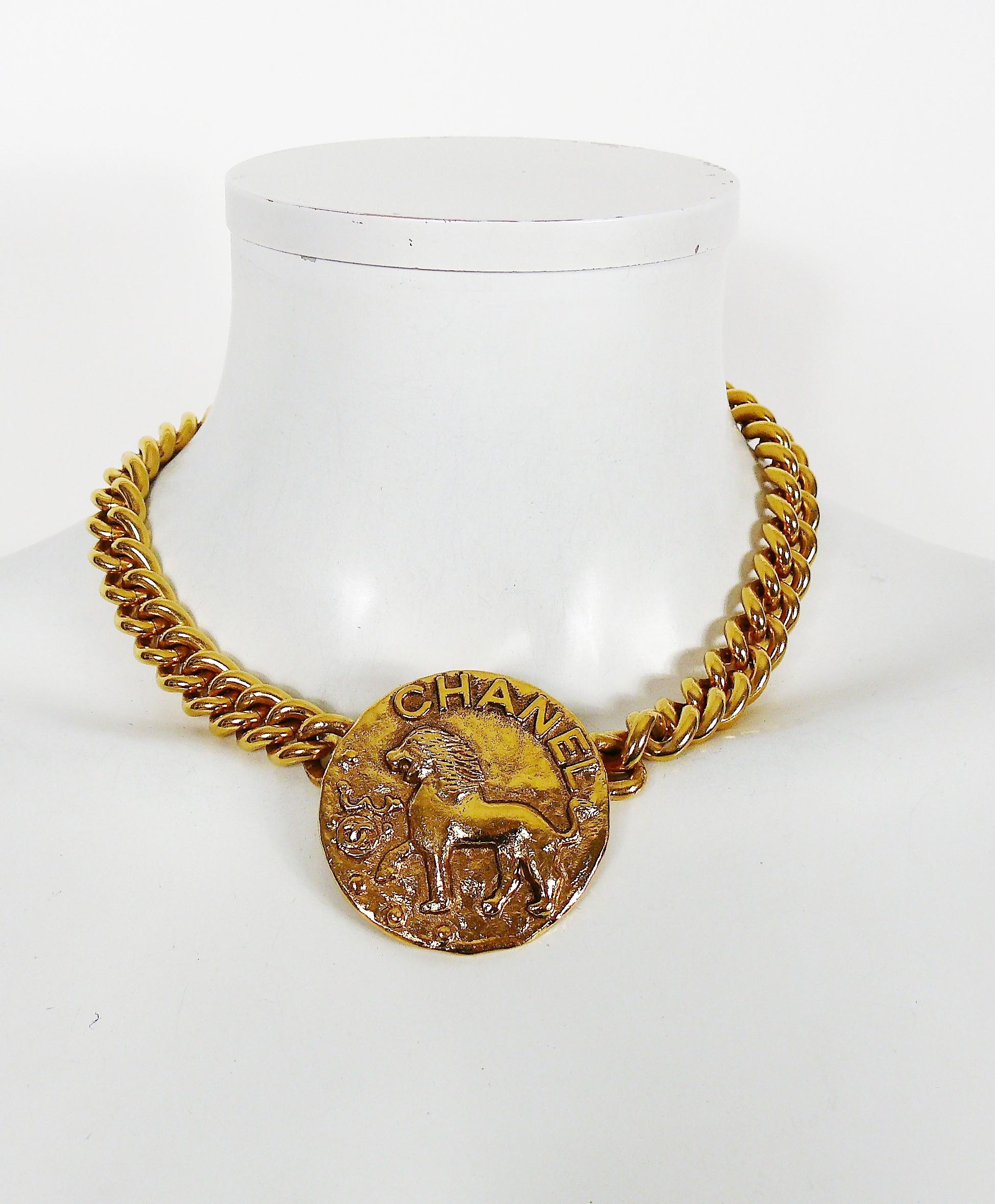 CHANEL vintage zodiac choker necklace featuring a chunky curb chain and a medallion lion in triumphant position, Chanel logo and CHANEL letters.

Lion is the symbol of COCO CHANEL astrological sign and her passion for Venice.

Collection 23 (year