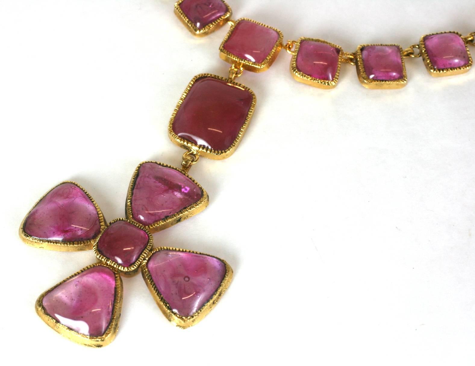 Chanel Byzantine style pale pink ruby collet set pate de verre poured glass necklace by Maison Gripoix.
The handmade gilt bronze Maltese cross pendant, with square and rectangular links randomly set with varying shades of the faux glass rubies, a
