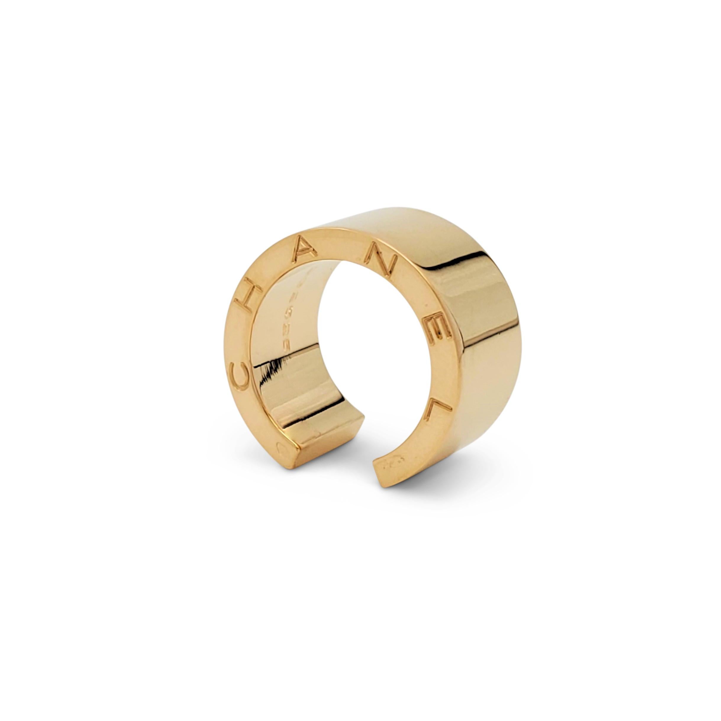 Authentic chic and understated Chanel 'C Signature' open band ring crafted in 18 karat yellow gold. Signed Chanel, 750, with serial number and French hallmarks. The ring is not presented with the original box or papers. CIRCA 2010s.

Ring Size: US