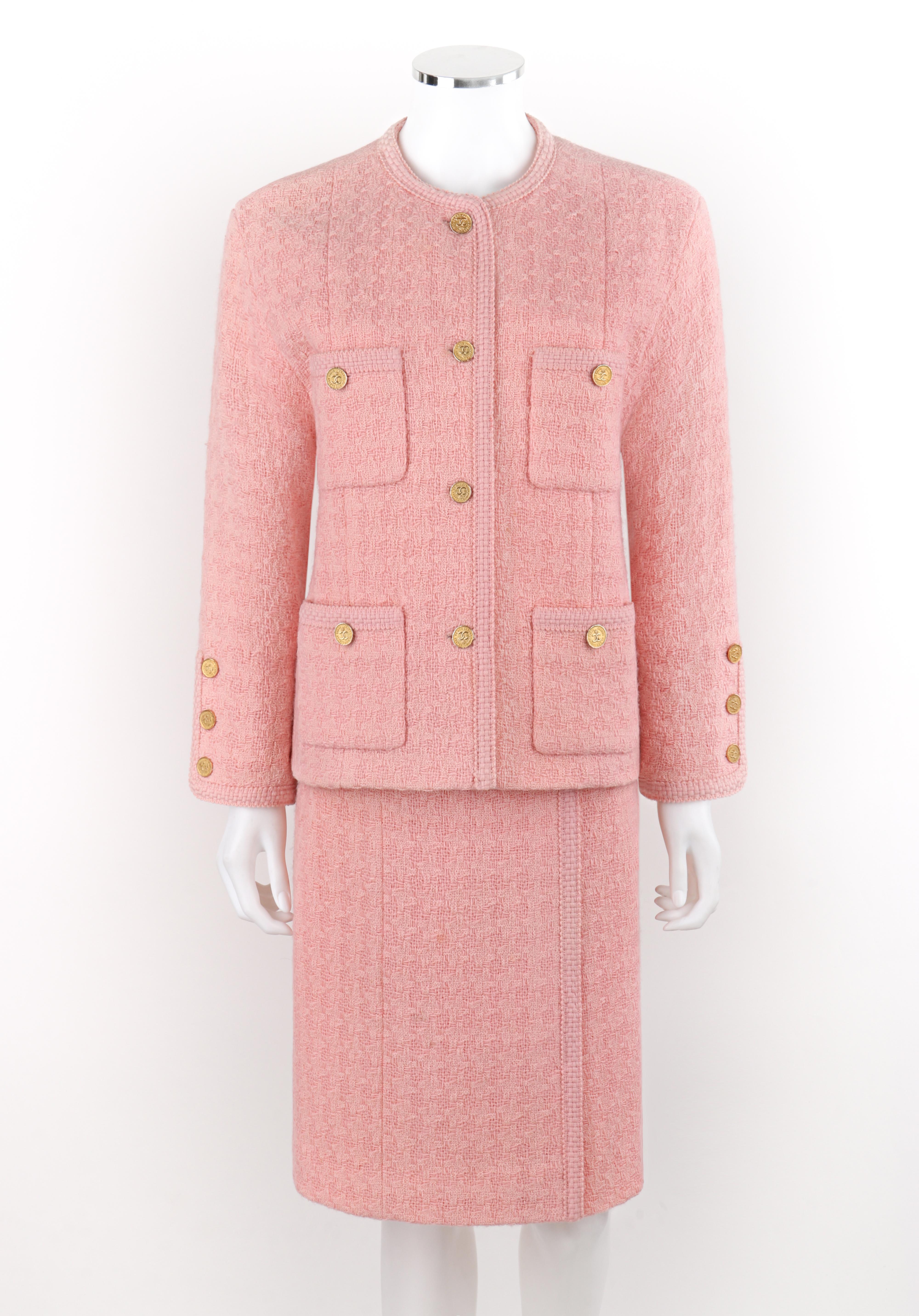 CHANEL c.1980's 2pc Pink Gold Button-Up Tweed Woven Trim Jacket Skirt Suit Set

Brand / Manufacturer: Chanel
Circa: 1980's
Designer: Karl Lagerfeld
Style: Jacket Skirt Suit Set
Color(s): Shades of pink, gold
Lined: Yes 
Unmarked Fabric Content (feel