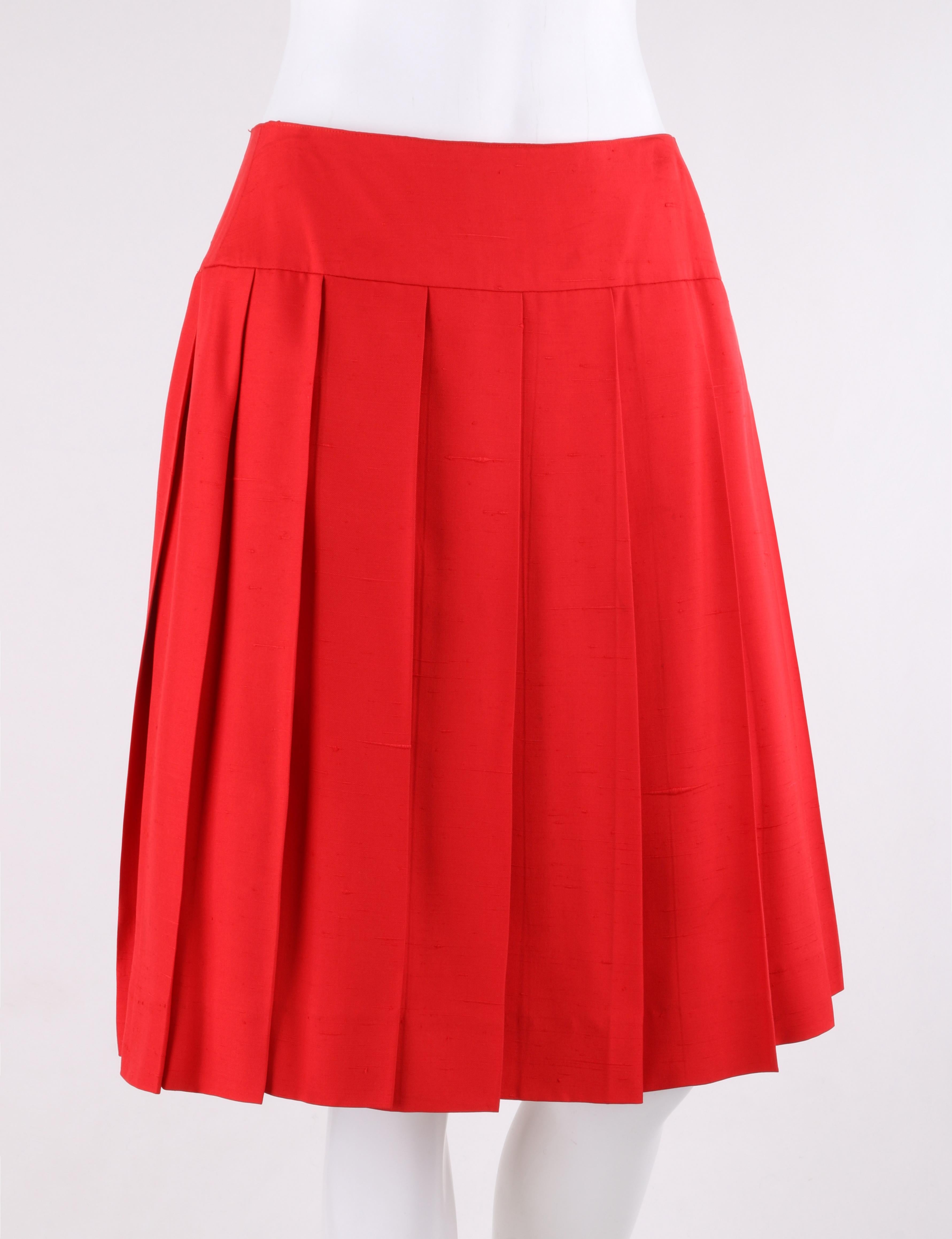 CHANEL c.1980’s Red Silk Classic Pleated Skirt  
 
Circa: 1980’s
Label(s): Chanel Boutique  
Style: Circular, pleated skirt
Color(s): Red
Lined: Yes
Unmarked Fabric Content: Silk
Additional Details / Inclusions: Red knife pleated circular skirt;