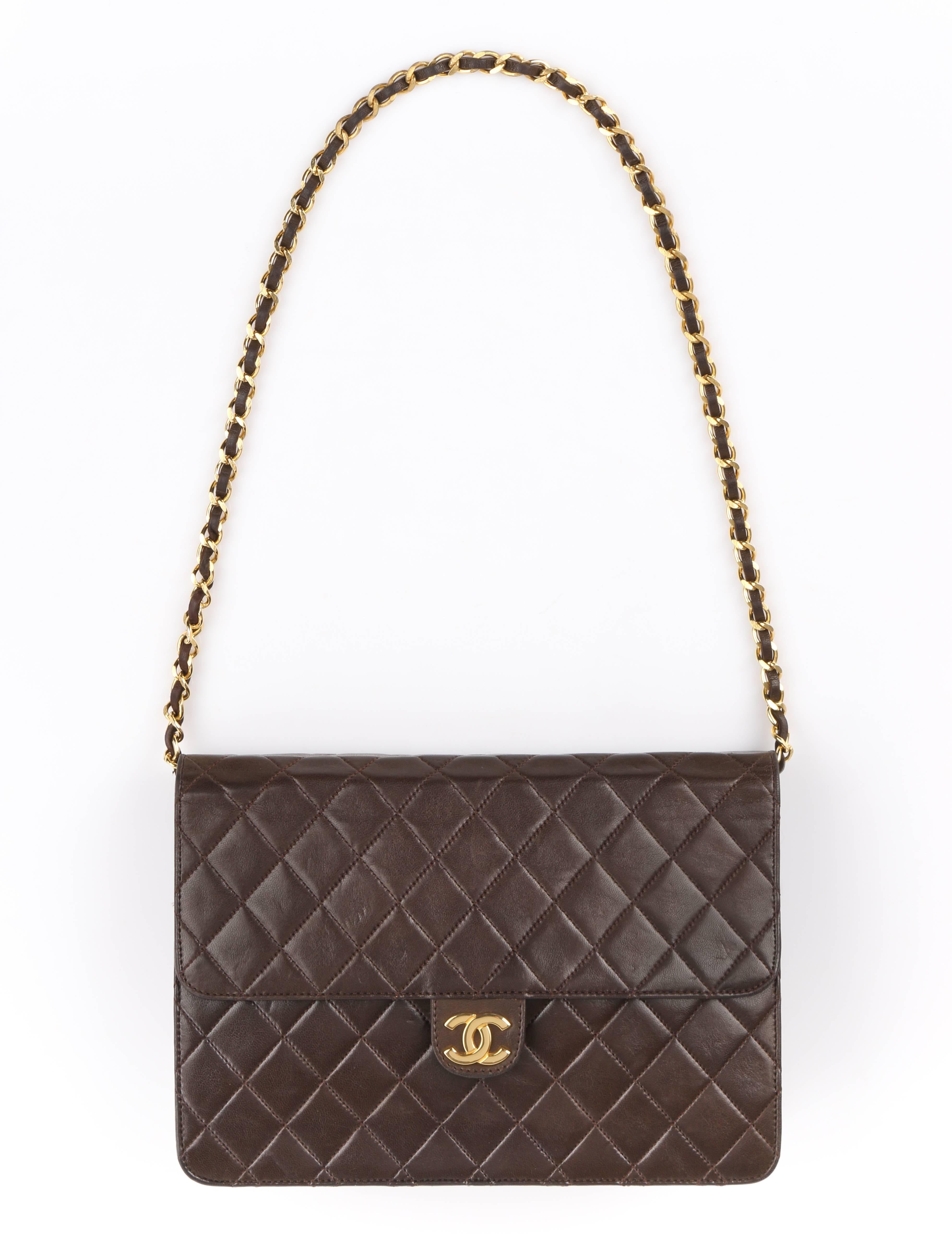 Chanel c.1990's brown diamond quilted lambskin leather classic flap bag. Designed by Karl Lagerfeld. Chocolate brown diamond quilted leather exterior. Flap top with gold-toned metal interlocking 