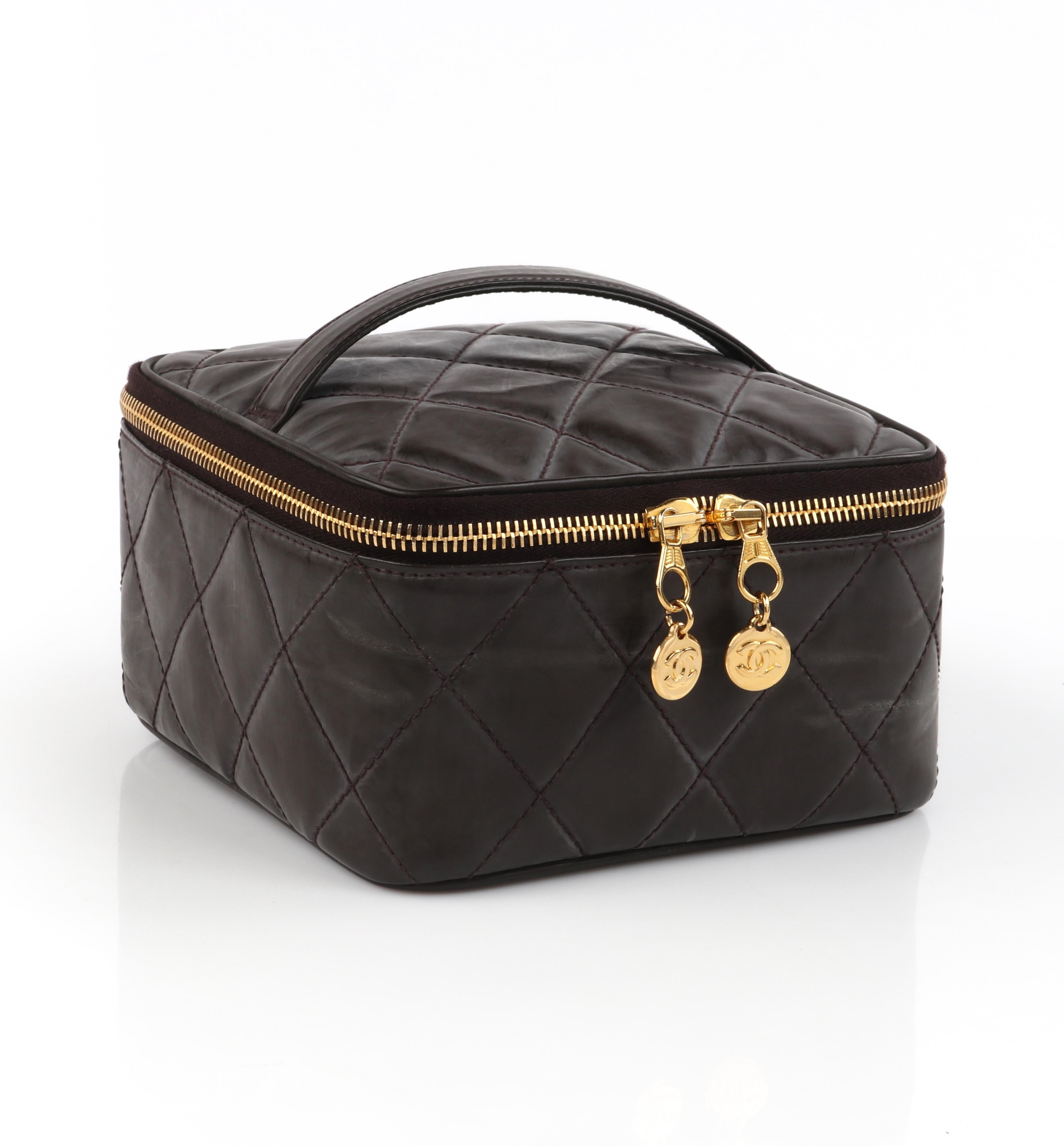 CHANEL 1996 Brown Coated Leather Quilted Zip Around Cosmetic Bag Travel Case

Brand / Manufacturer: Chanel
Designer: Karl Lagerfeld
Style: Cosmetic bag / Vanity bag / Travel case
Color(s): Shades of brown
Lined: Yes
Unmarked Fabric Content (feel