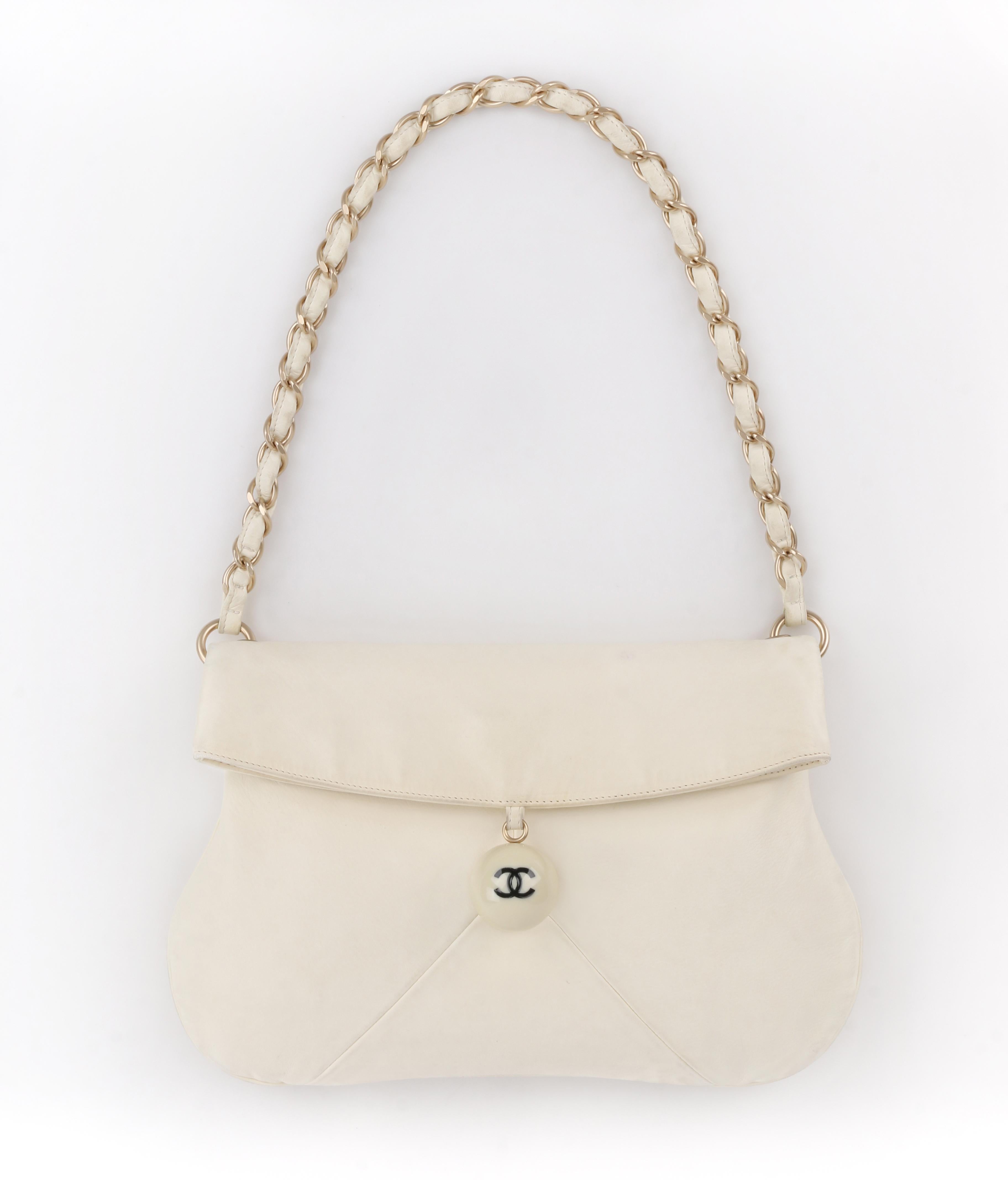 CHANEL c.2003 Ivory Lambskin Leather Coco Cue Ball Braided Chain Shoulder Bag
  
Brand / Manufacturer: Chanel
Collection: c.2003
Designer: Karl Lagerfeld
Style: Shoulder bag
Color(s): Shades of ivory (exterior); shades of off-white (interior); gold