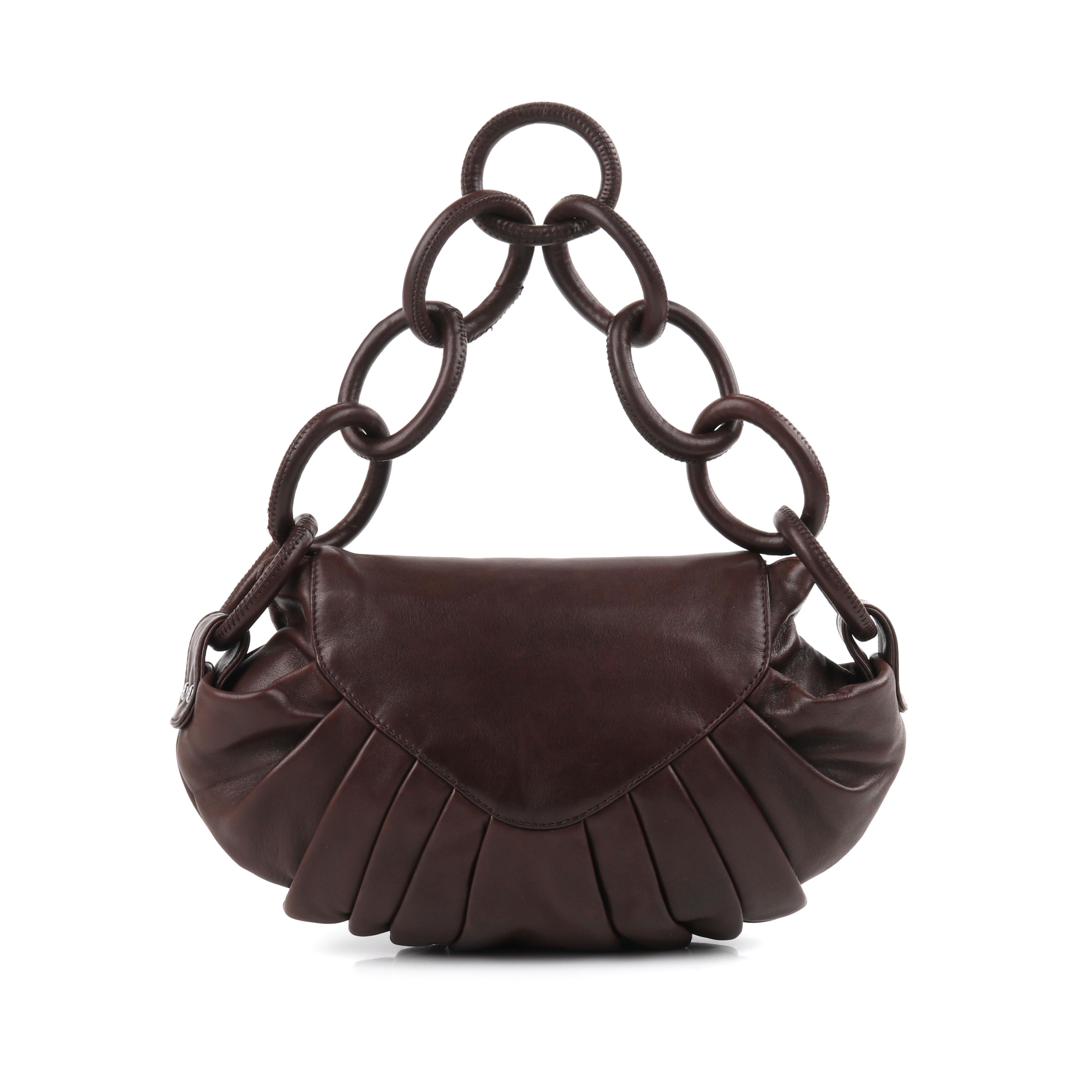 CHANEL c.2004 Hickory Brown Lambskin Leather Pleated Chain-Link Shoulder Bag
 
Estimated Retail: $1,750.00
 
Brand / Manufacturer: Chanel
Collection: c.2004
Designer: Karl Lagerfeld
Style: Handbag / shoulder bag
Color(s): Shades of dark brown