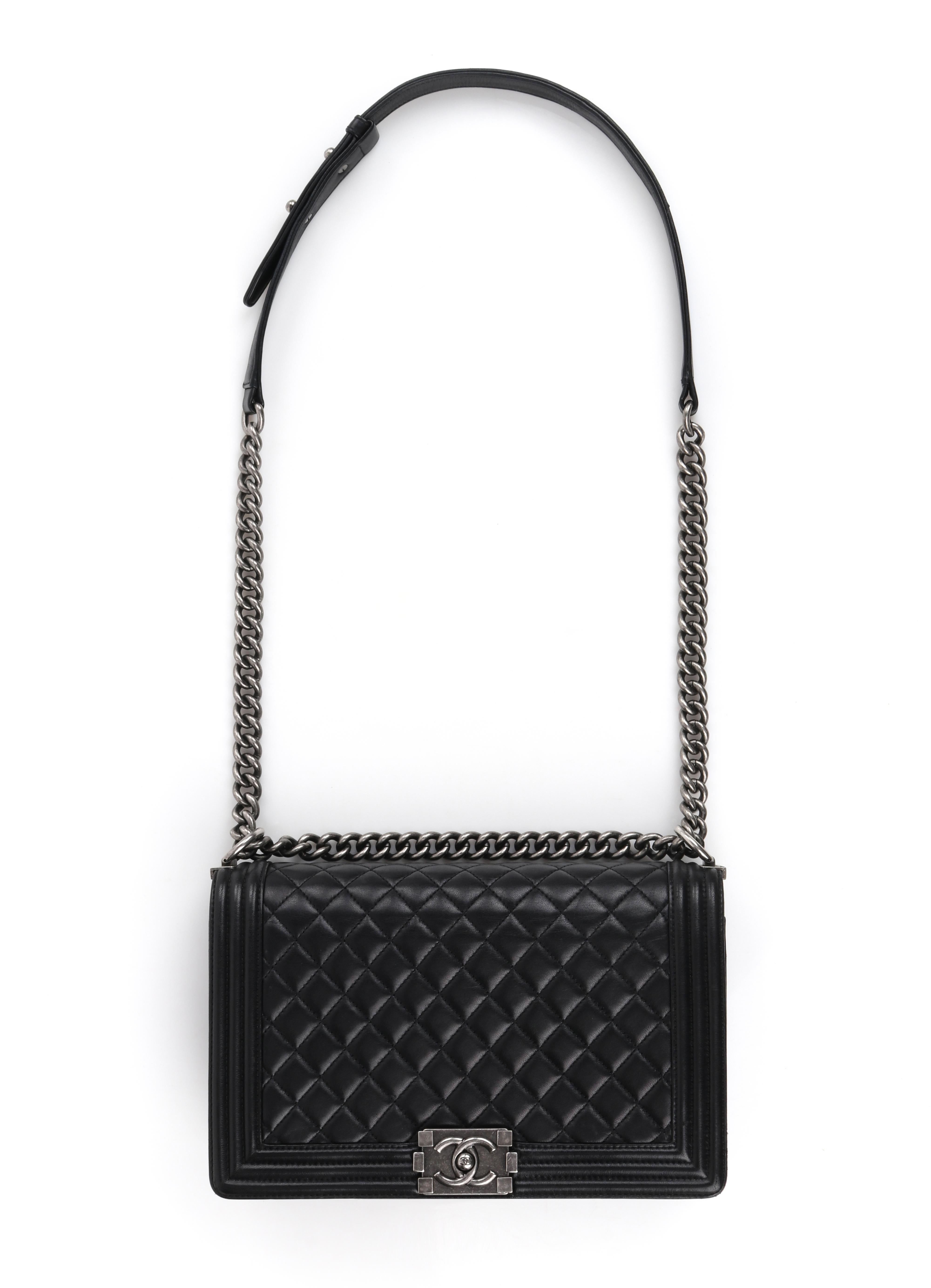 CHANEL c.2018 “Boy” Large Black Quilted Leather Flap Chain Strap Shoulder Bag
 
Brand/Manufacturer: Chanel
Circa: 2017/2018
Collection: Boy Chanel
Style: Shoulder bag
Color(s): Black and Silver
Lined: Yes
Unmarked Fabric Content (feel of): Calfskin