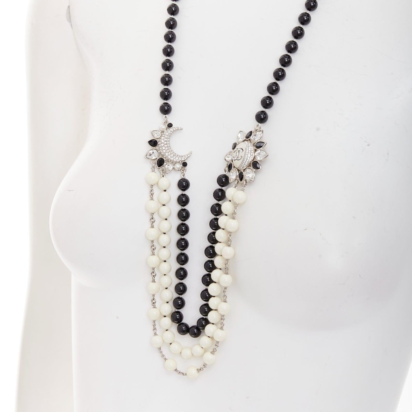 Sautoir CHANEL C23C cristal CC logo soleil lune noir blanc perles
Référence : TGAS/E00837
Marque : Chanel
Designer : Virginie Viard
Collectional : C23C
Matériau : Acrylique
Couleur : Noir, Whiting
Motif : Solide
Fermeture : Fermeture à