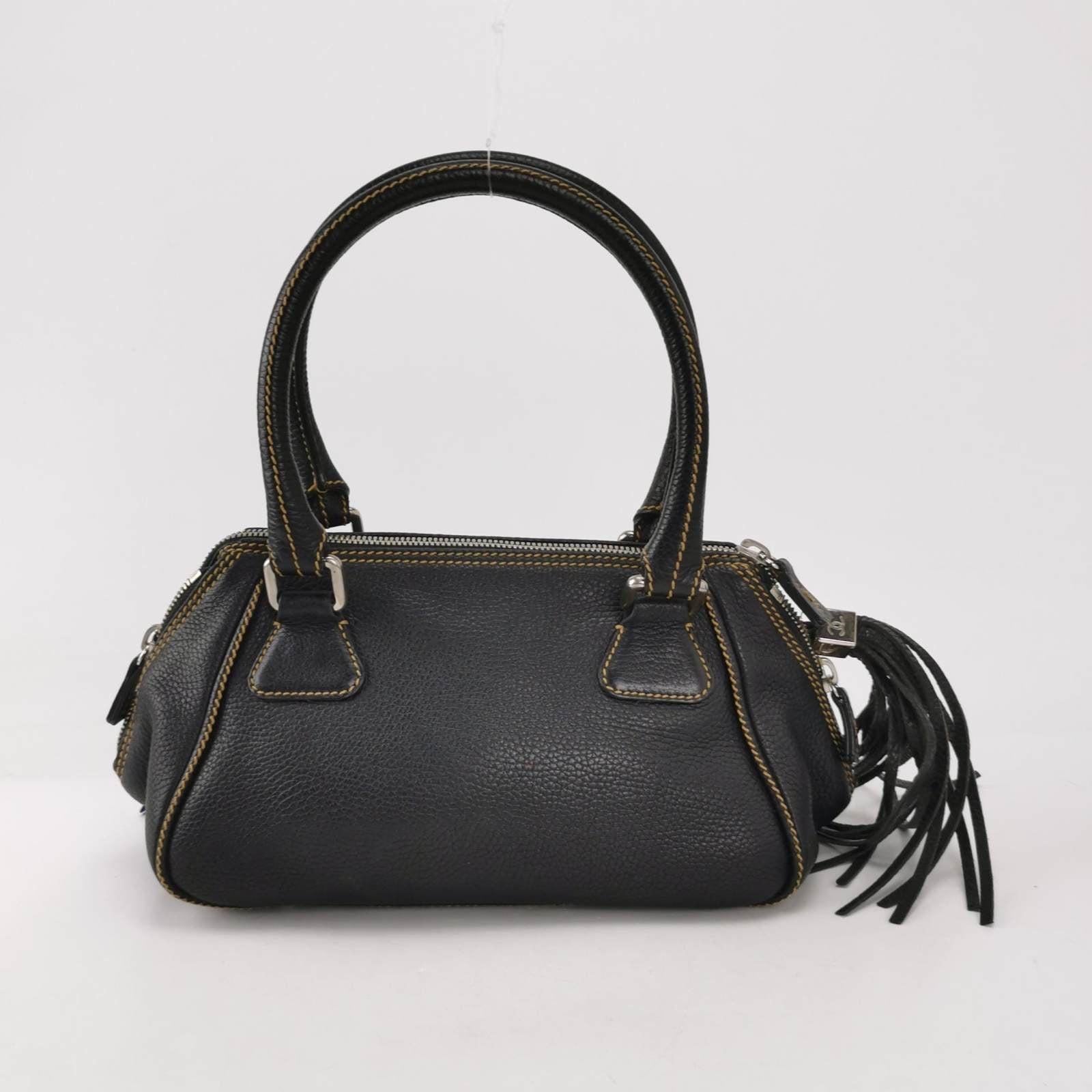 CHANEL Calfskin Leather Tassel Medium Black Bowler bag These are professional photos of the actual bag offered by Luxbags. This is a genuine CHANEL Caviar Patent Quilted Small Bowler Bag in black. Expertly crafted in durable pebbled calfskin