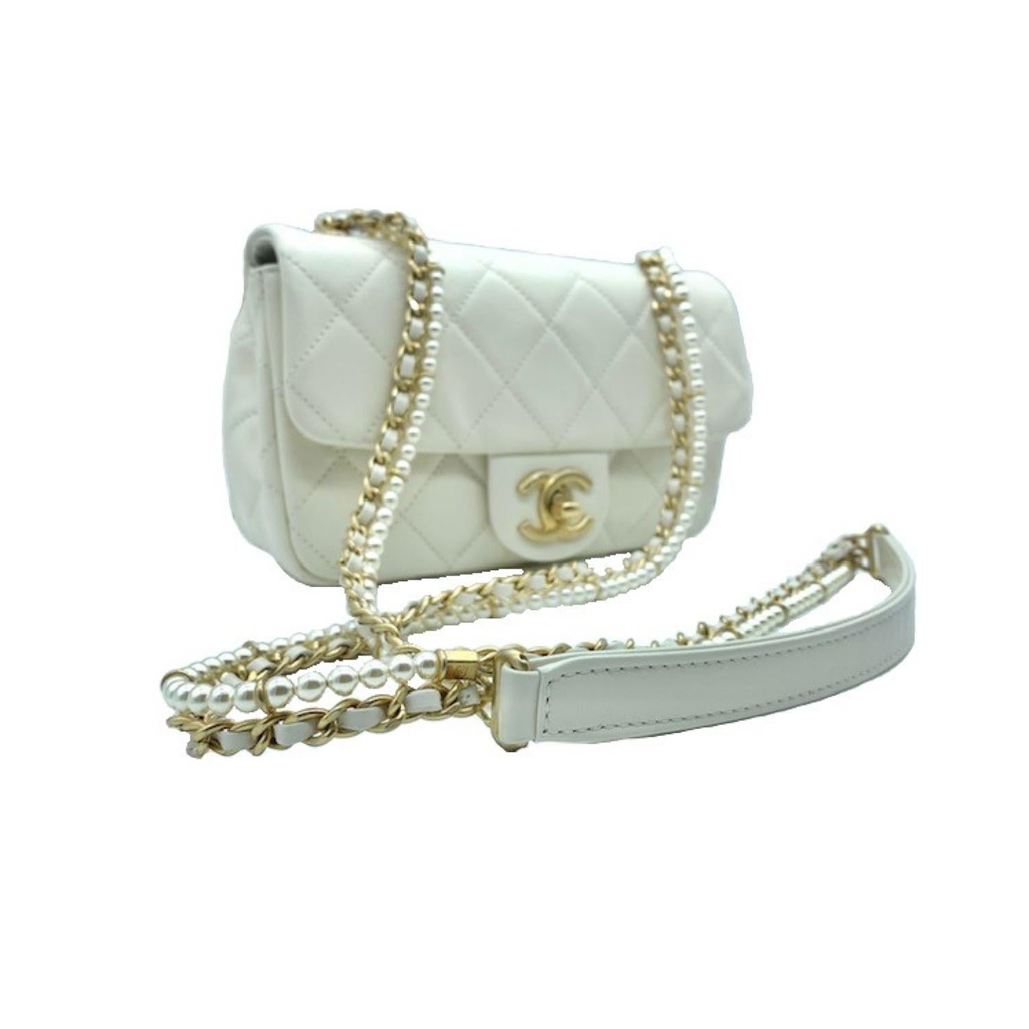 Chanel Calfskin Quilted Mini Rectangular Crystal Pearls Chain Flap. The chic mini crossbody classic is crafted in soft quilted calfskin leather in off-white. The bag features a gold chain link leather threaded shoulder strap with pearl accents and a