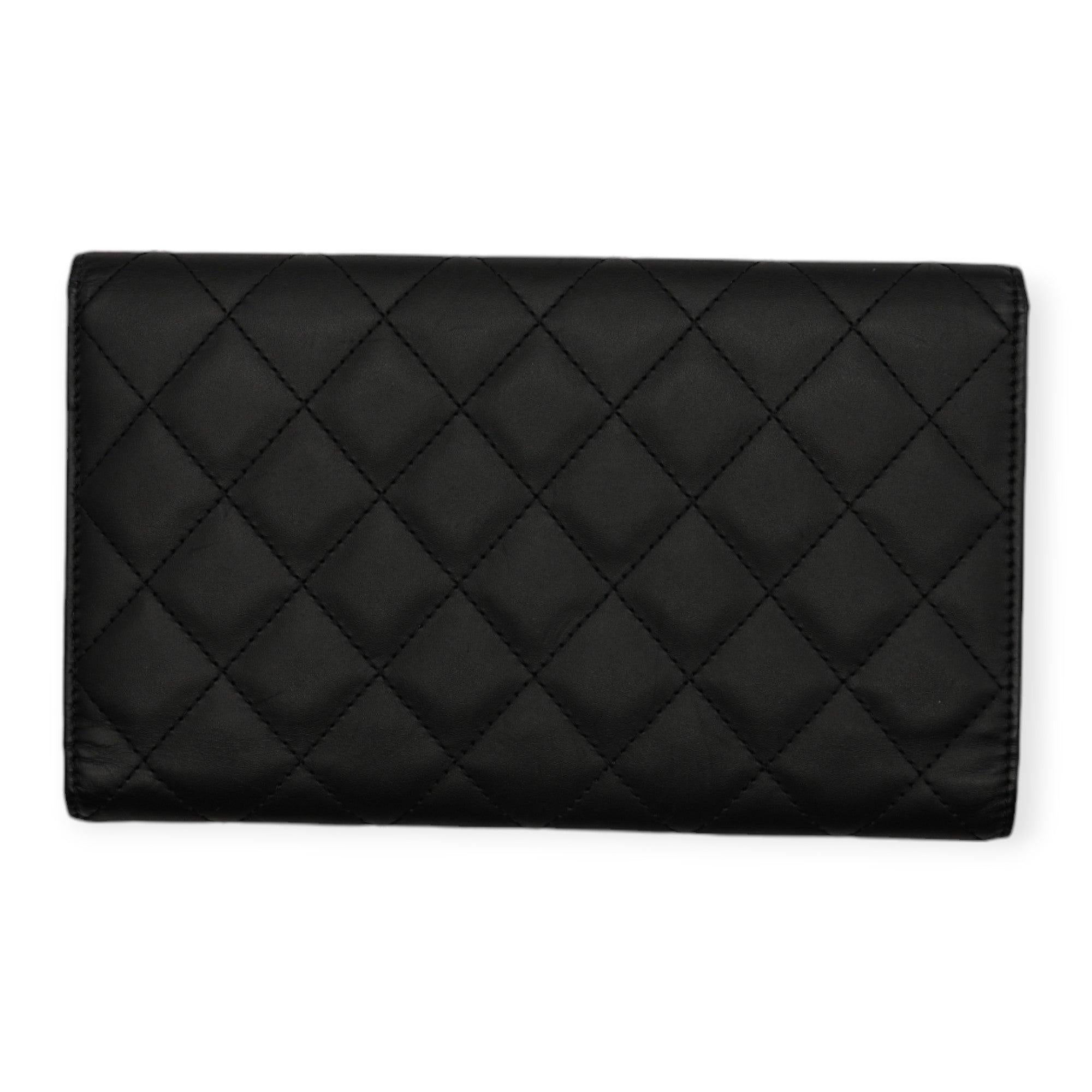Elevate your style with the Chanel Cambon Black and Pink Long Wallet, a luxurious yet practical accessory for the modern woman. Despite some signs of wear, this pre-owned leather wallet is in good condition and features a well-organized interior