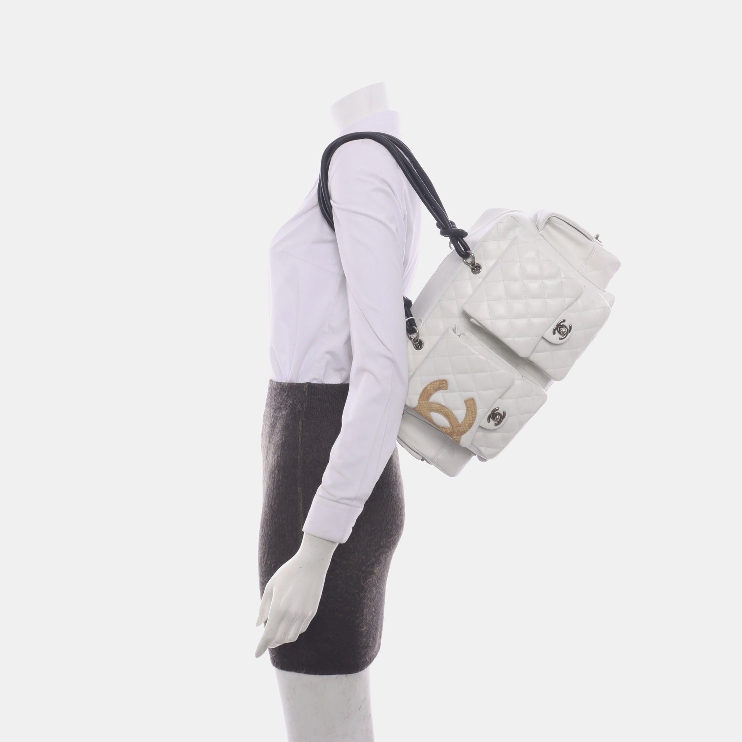 Chanel Cambon Multi-pocket Ligne Reporter Bag Large White Calfskin Leather
 These are professional photos of the actual bag.
 Named after the Cambon street in Paris the Chanel store is located. This highly coveted bag is inspired by classic utility