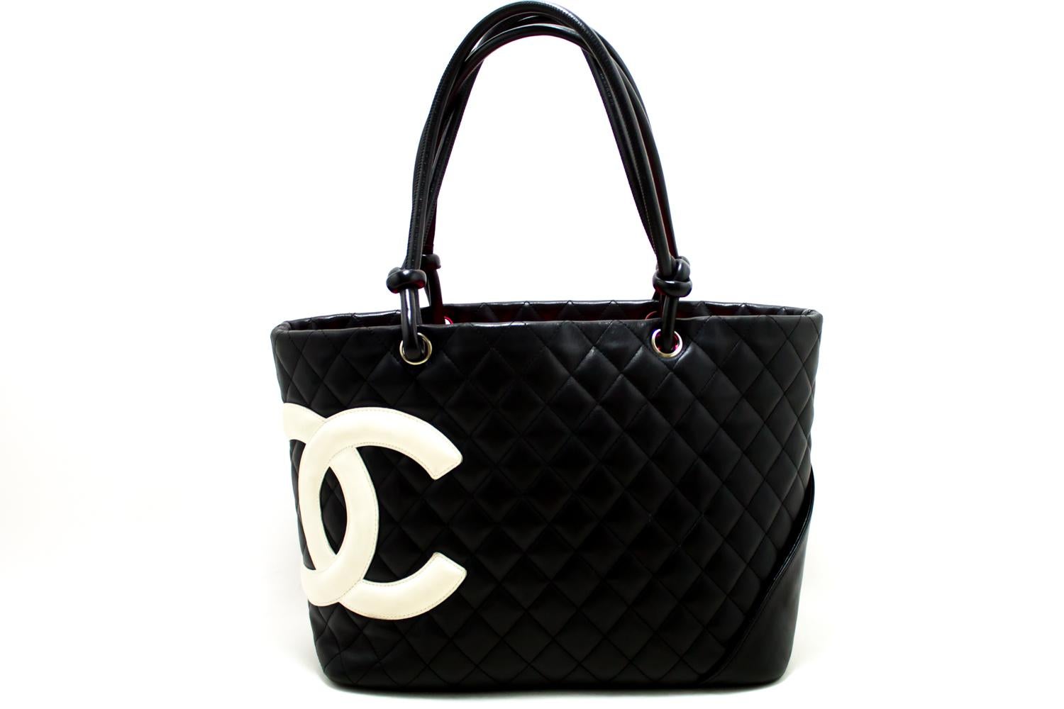 An authentic CHANEL Cambon Ligne Tote Large Shoulder Bag Black White Quilted Calfskin. The color is Black. The outside material is Leather. The pattern is Solid.
Conditions & Ratings
Outside material: Calfskin
Color: Black
Closure: Zipper
Hardware: