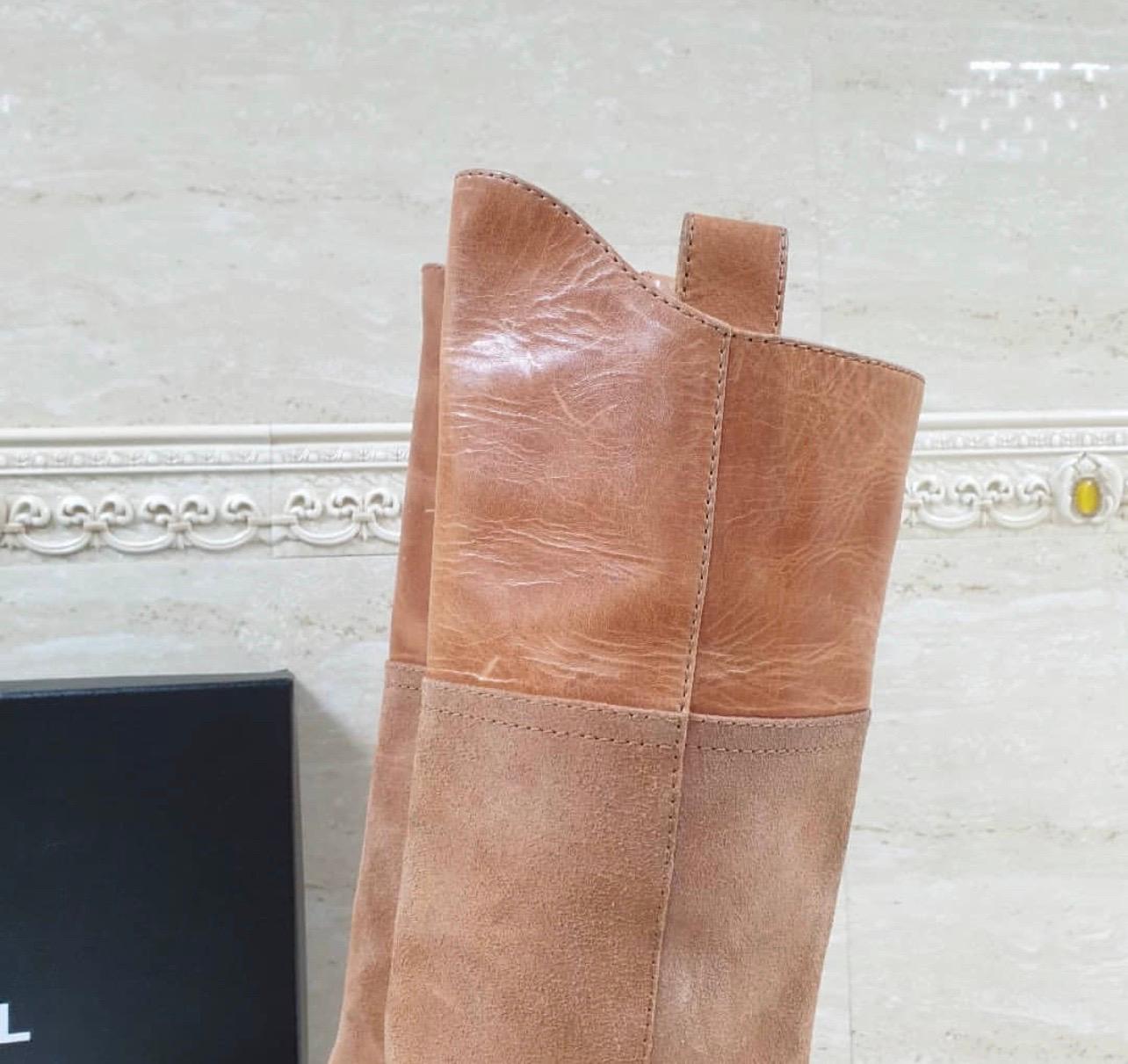 Chanel Paris-Dallas Mid-Calf Boots



Caramel textured suede and leather Chanel Paris-Dallas square-toe mid-calf boots with interlocking CC embroidery at sides and stacked heels. 



Size:38



Condition: very good



No original packaging.