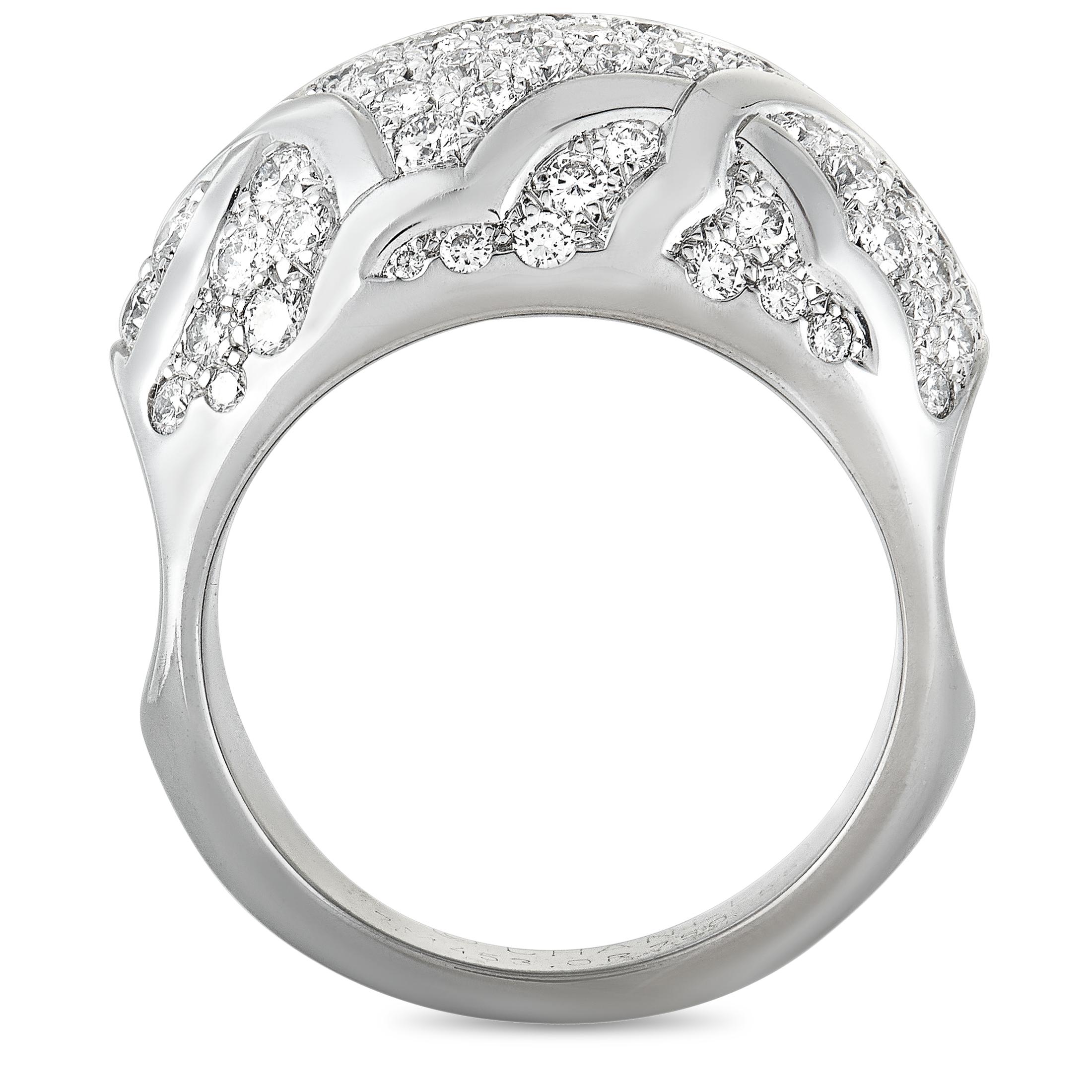 The Chanel “Camélia” ring is made out of 18K white gold and diamonds that total 1.75 carats. The ring weighs 18.3 grams, boasting band thickness of 4 mm and top height of 7 mm, while top dimensions measure 23 by 13 mm.

This jewelry piece is offered