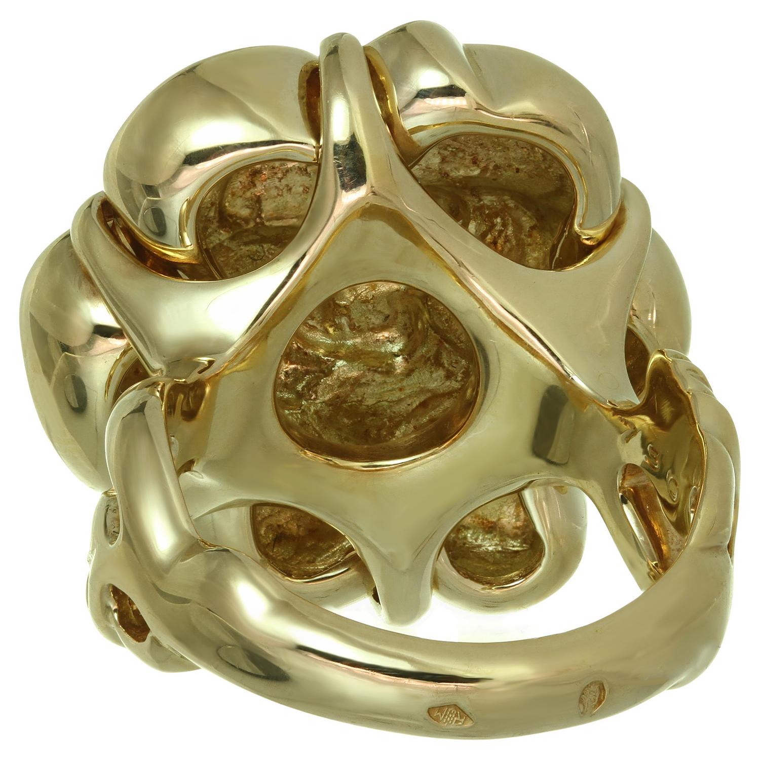 This gorgeous Chanel ring from the elegant Camelia collection features the classic flower design crafted in 18k yellow gold. Made in France circa 2010s. Measurements: 0.90