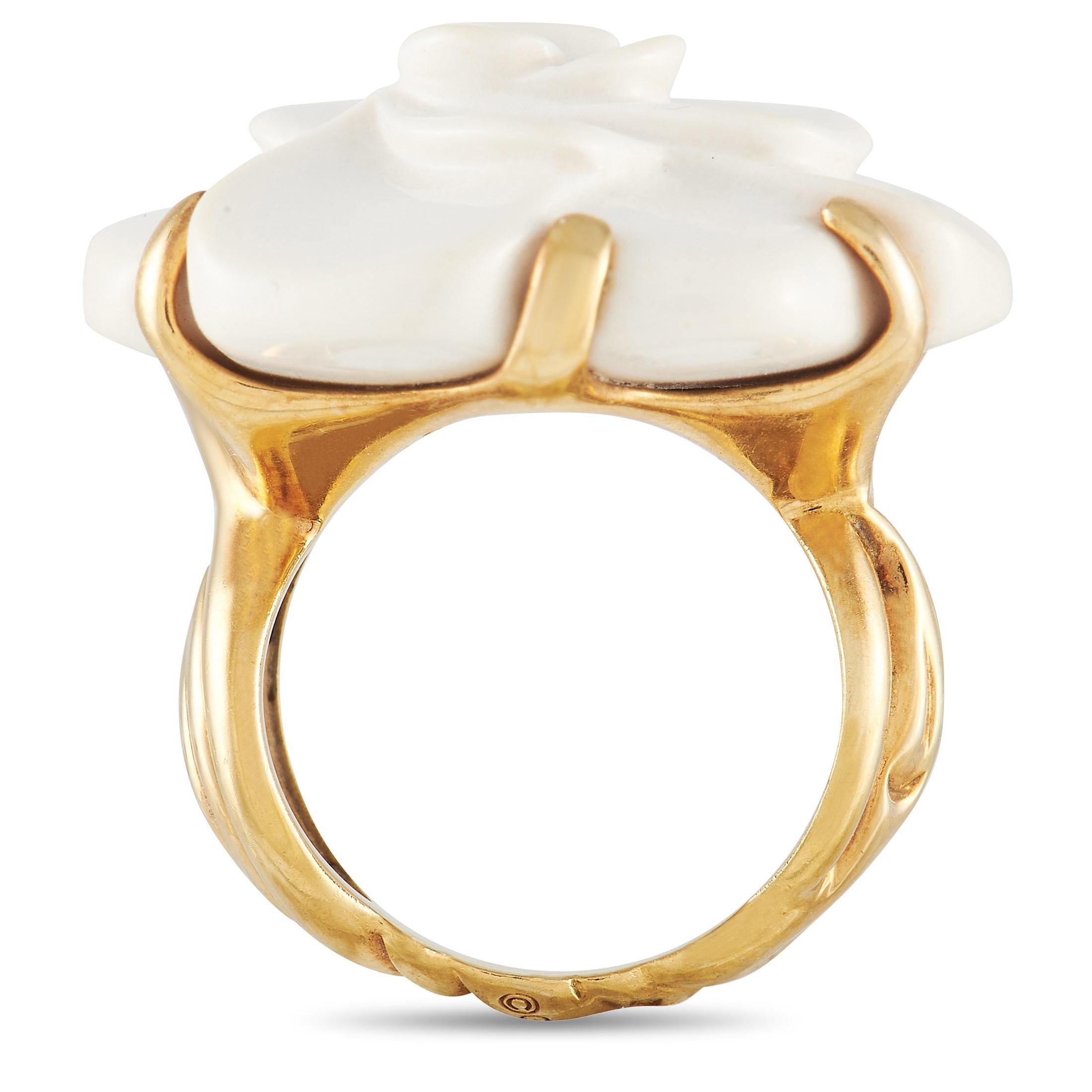 It doesn’t get any more chic or sophisticated than this Chanel Camelia ring. A matte White Agate floral motif makes a statement at the center of the simple, opulent 18K Yellow Gold setting. This piece features a textured band measuring 8mm wide and