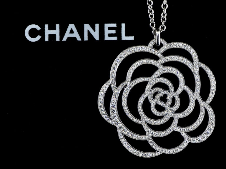 CHANEL 'CAMÉLIA AJOURÉ' DIAMOND PENDANT NECKLACE, PARIS, C. 2010.
In 18K white gold, exactly 375 diamonds amounting to conservatively 8 cts. in total.  The pendant itself, designed by Lorenz Baumer, has its unique-to-Chanel trefoil opening at its