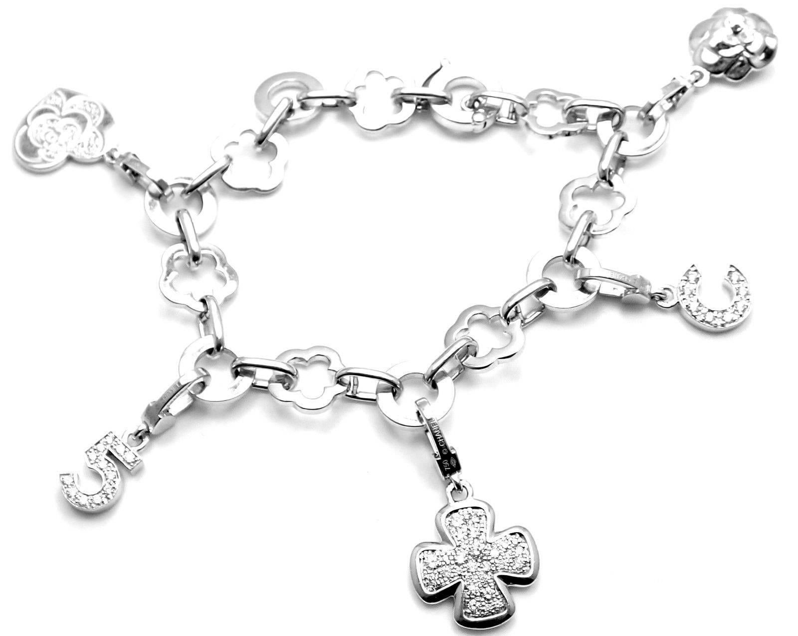 18k White Gold Camellia Camélia 5 Diamond Charm Link Bracelet By Chanel.
With 64 round brilliant cut diamonds VVS1 clarity, E color
Details: 
Length: 7.25
