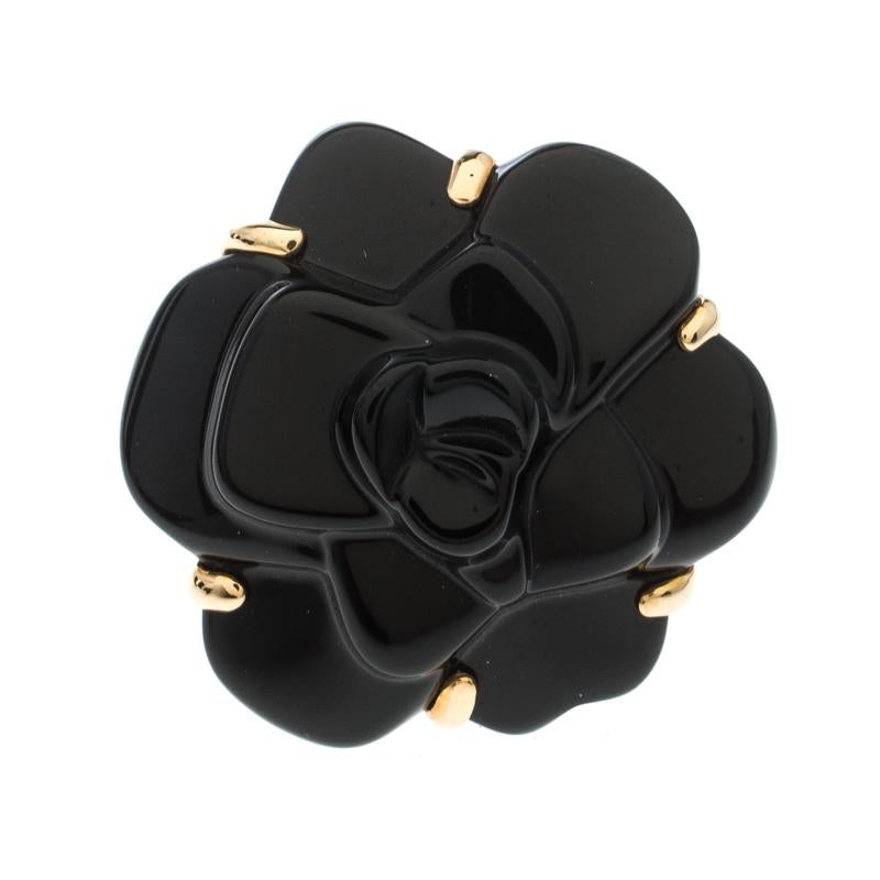 Adorn your finger with this immaculately designed cocktail ring from Chanel's timeless Camelia collection. The label is known for infusing firm attention to each detail which makes each of their creation unique and special. This ring, sculpted in