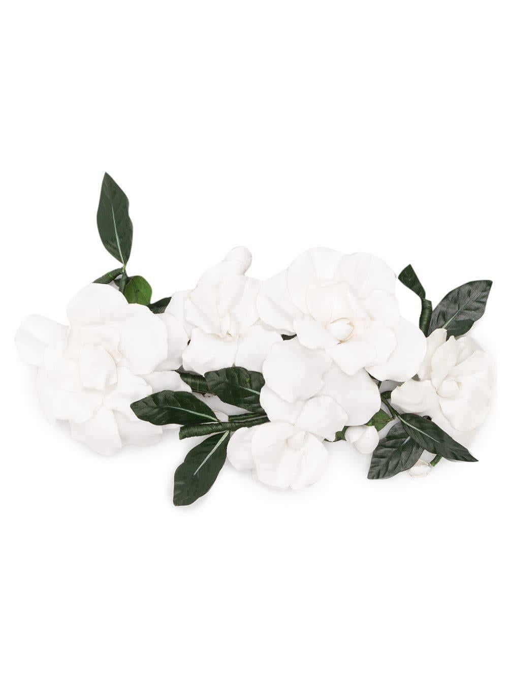 Add a youthful, preppy vibe to your look with a vintage floral hair barrette from Chanel. Crafted from a combination of silver-tone metal, white and green acetate, this piece features a clasp fastening and a timeless camelia design that people won't