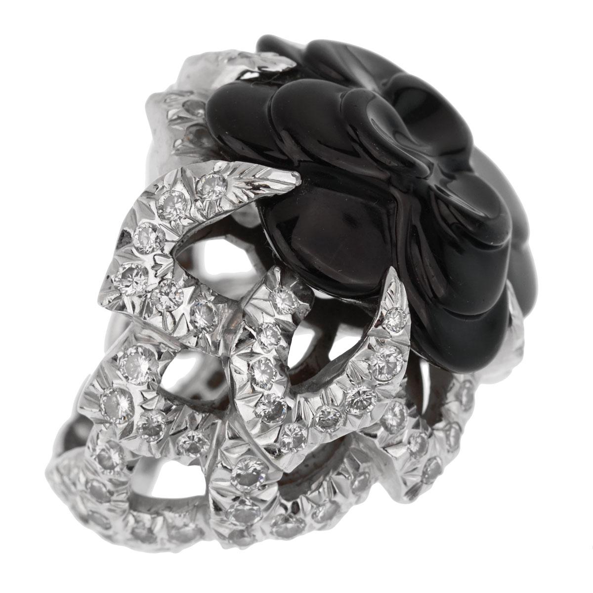 An iconic Chanel “Camélia” ring crafted in 18k white gold, the ring boasts a carved onyx and is adorned with 3cts appx of the finest chanel round brilliant cut diamonds. 

The ring measures a 6 1/4 and is resizeable