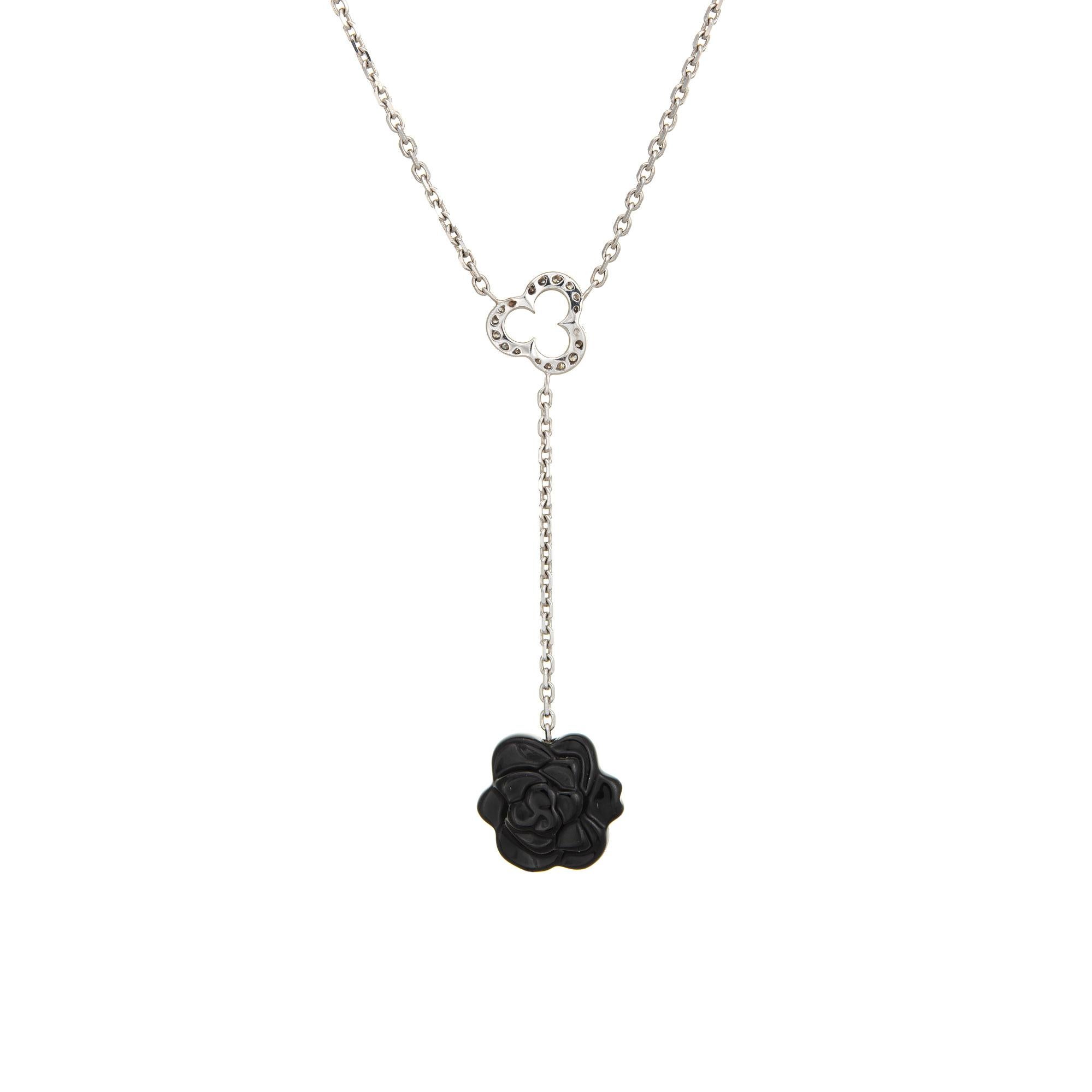 Elegant and finely detailed estate Chanel Camelia Sculpte necklace crafted in 18 karat white gold.  

Carved onyx flower measures 14mm diameter, accented with an estimated 0.08 carats of diamonds (estimated at F-G color and VVS2 clarity). The onyx