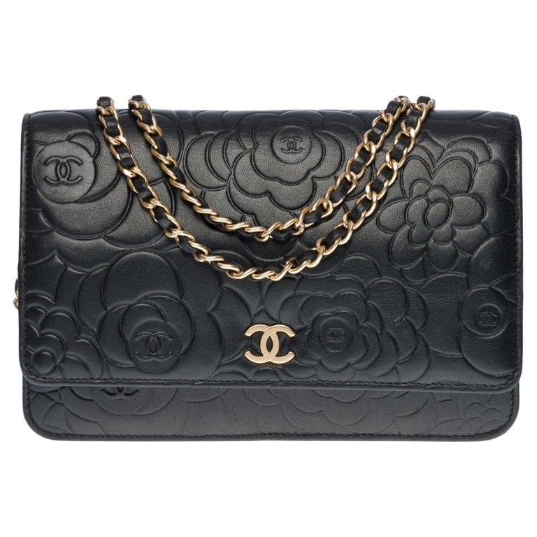 Chanel Camelia Wallet on Chain (WOC) shoulder bag in black quilted leather,  CHW at 1stDibs