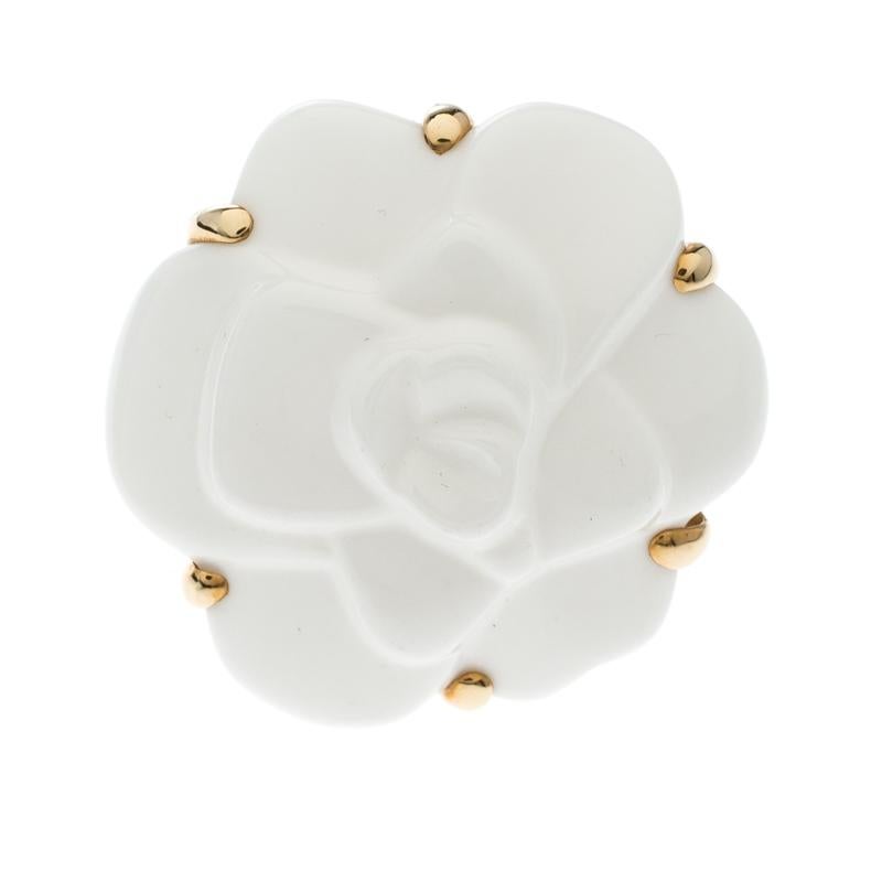 Adorn your finger with this immaculately designed ring from Chanel's timeless Camelia collection. The label is known for infusing firm attention to each detail which makes each of their creation unique and special. This ring, sculpted in 18K yellow