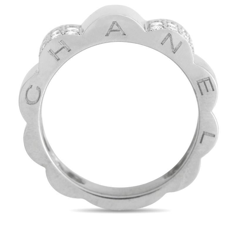Scalloped edges add texture and dimension to this classic Chanel Camellia ring. Made from opulent 18K White Gold, clusters of inset diamonds allow this piece to shine to life whenever it catches the light. This elegant accessory measures 4mm wide