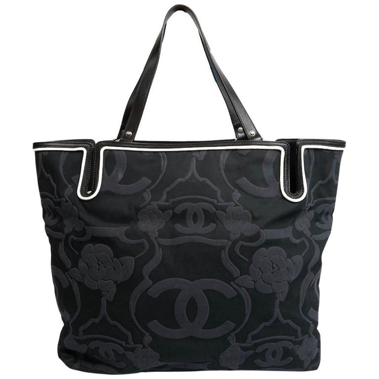 CHANEL Camellia And CC Embossed Canvas Tote Bag
