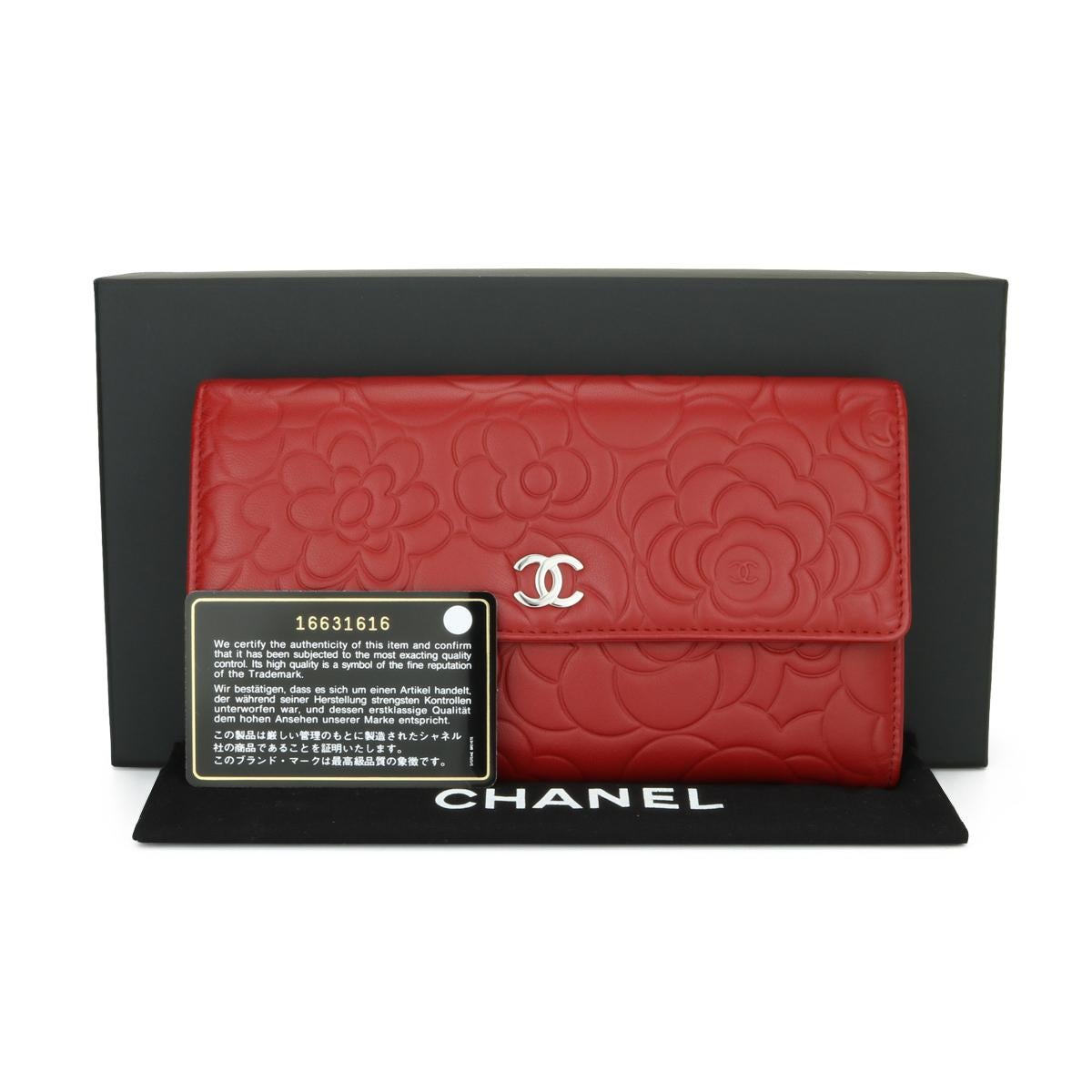 CHANEL Camellia Embossed Long Flap Wallet Red Lambskin Leather with Silver Hardware 2012.

This stunning Tri-Fold Flap wallet is in excellent condition, the wallet still holds its original shape, and the hardware is still very shiny.

- Exterior