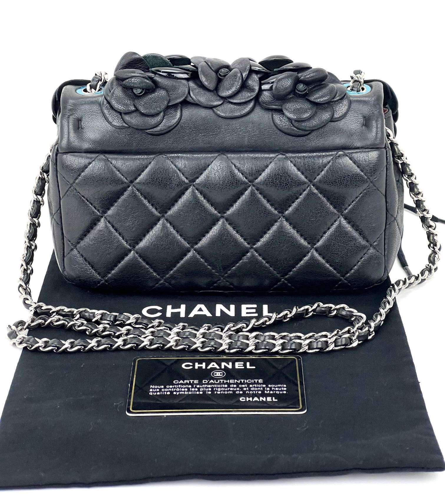 Pre-Owned  100% Authentic
CHANEL Lambskin Patent Around Camellia Flap Bag
Use as a Shoulder, Crossbody or Clutch
RATING: B...Very Good, well maintained, 
shows minor signs of wear
MATERIAL: lambskin, patent leather
STRAP: chain with leather