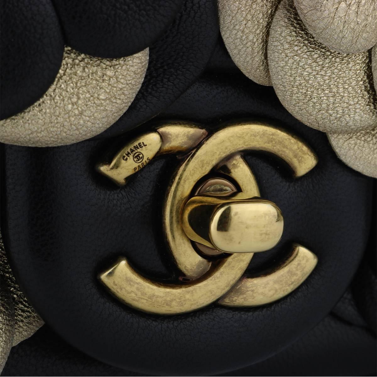 Authentic CHANEL Camellia Mini Black/Gold Lambskin with Antique Gold Hardware 2015 Limited Edition

This stunning bag is in a mint condition, the bag still holds the original shape, and the hardware is still very shiny.

Exterior Condition: Mint
