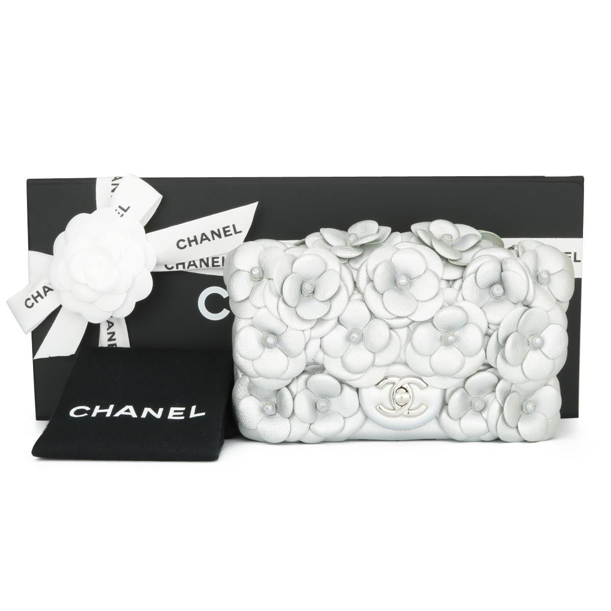 CHANEL Camellia Mini Flap Bag Metallic Silver Lambskin with Silver Hardware 2016 Limited Edition.

This stunning bag is still in excellent condition; the bag still holds the original shape and the hardware still shiny.

- Exterior Condition: