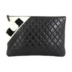 Chanel Camellia O Case Clutch Quilted Lambskin Large