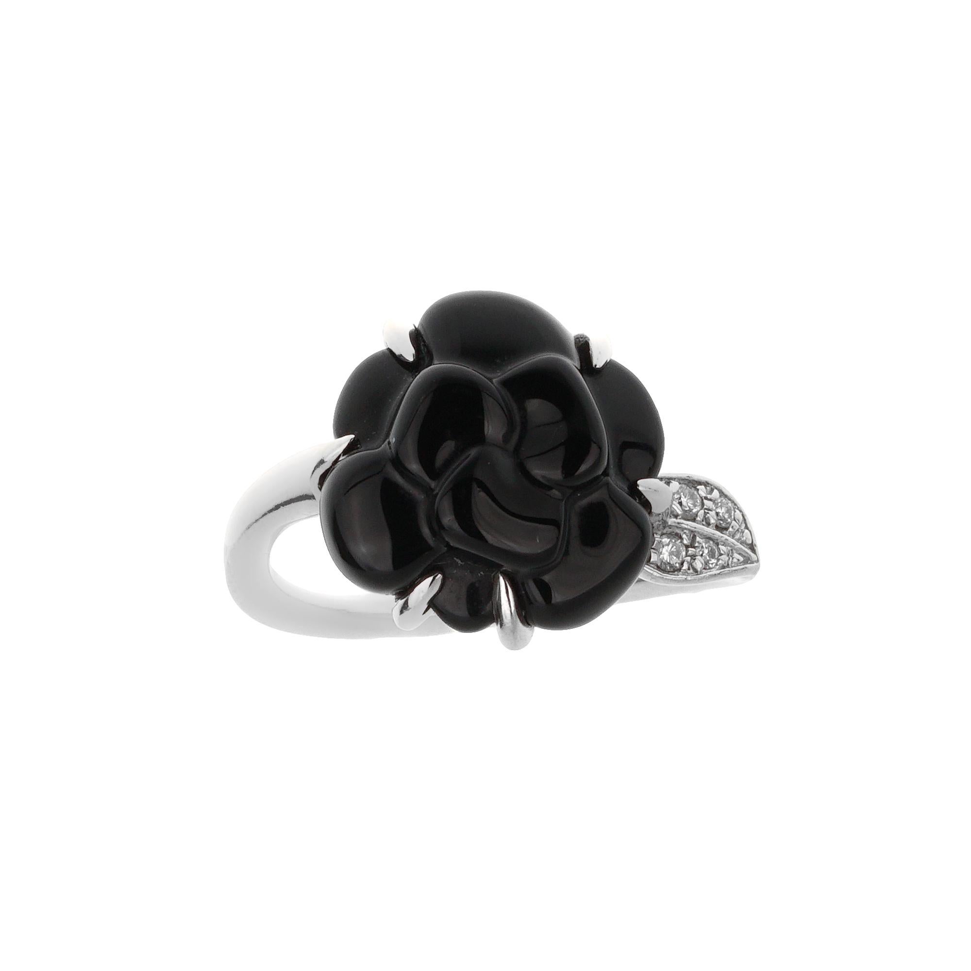 The Chanel Camellia Onyx Diamond White Gold Cocktail Ring is a stunning homage to the iconic camellia flower, a signature symbol of the Chanel brand. Crafted with meticulous attention to detail, this exquisite piece blends timeless elegance with