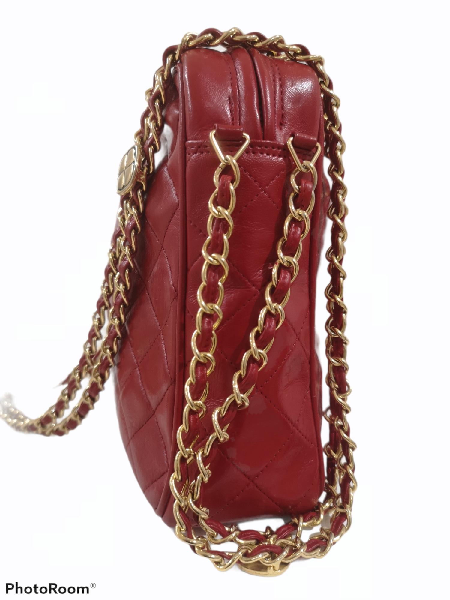 Chanel red leather gold tone chain shoulder bag
90s Red Chanel CC logo on the front, gold tone hardware with red leather fringes on the side and a red and gold tone shoulder strap
Can easily be worn as a crossbody too
Measurements: 21 * 27 cm, 8 cm