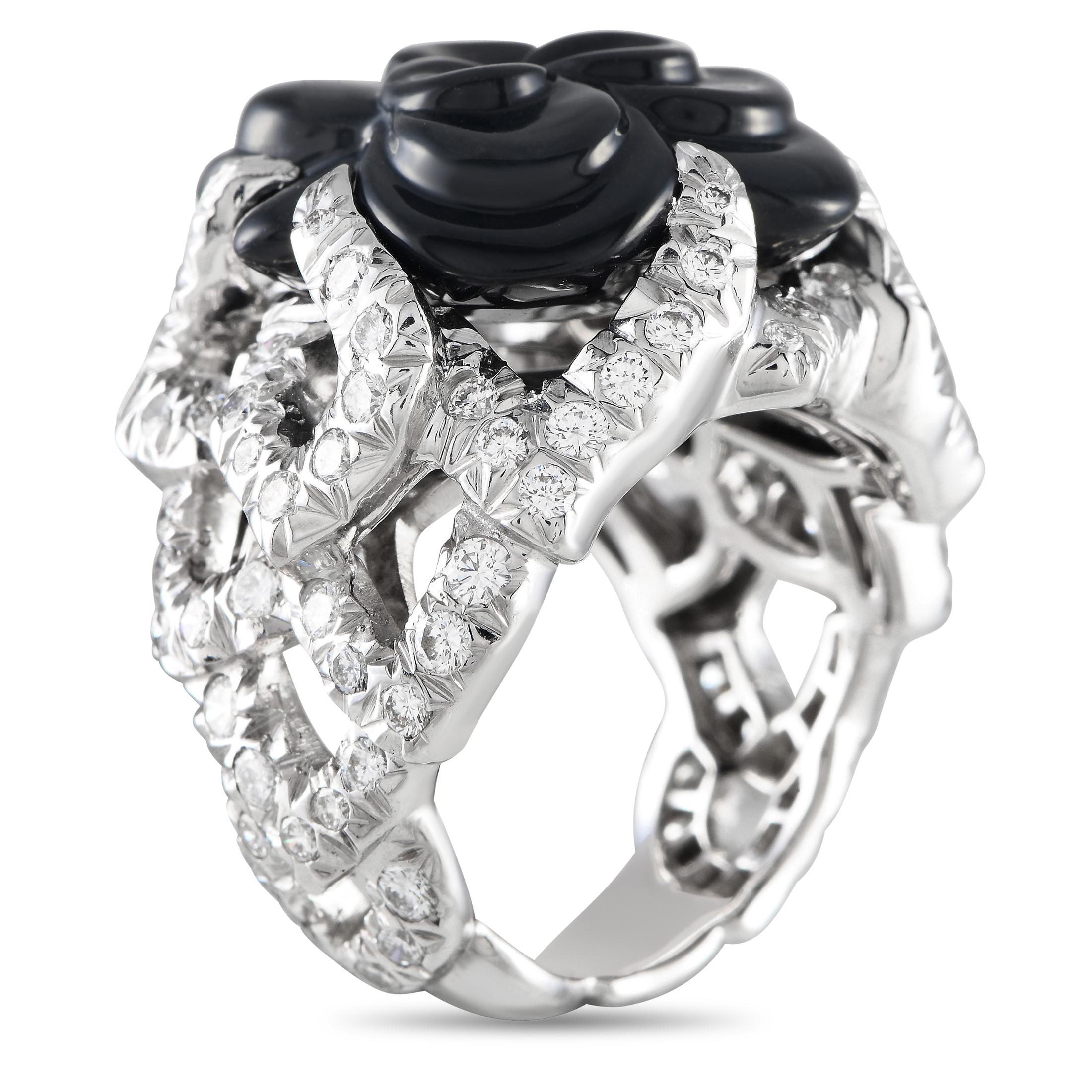 Keep your style blossoming year-round with this Chanel Camlia cocktail ring. This 18K white gold ring bears a carved onyx camellia flower that sprouts from a bush of round brilliant cut diamonds. This statement-making ring will give any special