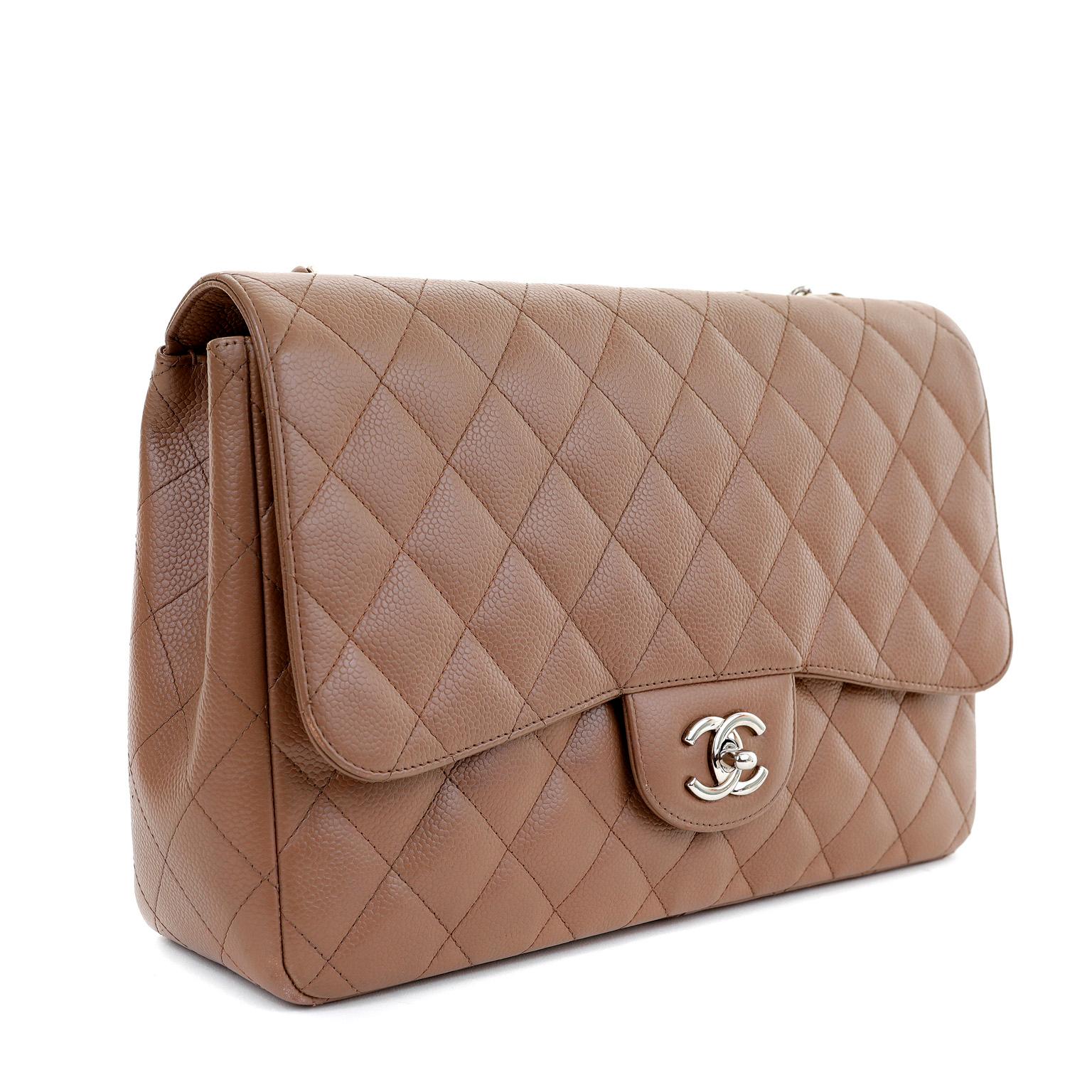 This authentic Chanel Caramel Caviar Jumbo Classic Flap Bag is in pristine condition.  A must have for any collector, the Jumbo Classic is elegant and timeless.

Durable and textured caramel colored caviar leather is quilted in signature Chanel