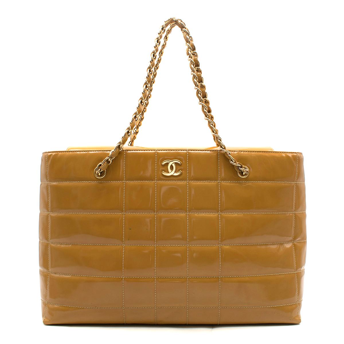 Chanel Caramel Quilted Patent Leather Shoulder Bag

- Quilted caramel, patent 
  leather
- Shiny gold hardware
- Shoulder straps with 
  signature interwoven leather 
  and gold chain straps
- CC hardware on 
  front of bag
- One large inner pouch