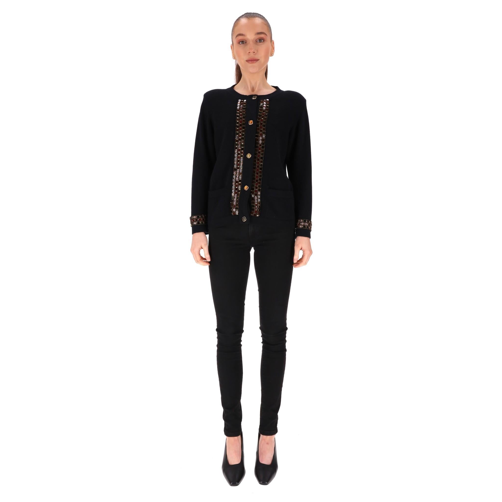 Chanel Cashmere Jewelled Cardigan/Jacket

From Paris - Byzance Pre-Fall 2011 Collection is this very rare piece.

Black cardigan fully crafted form cashmere and  detailed with sparkling gold jewel buttons with gold trim and signature 'CC'