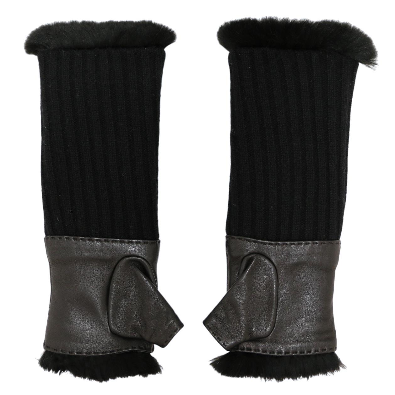 Beautiful black CHANEL mittens with real fur details

Condition : very good
Made in France
Size : 7
Material : cashmere, rabbit, lambskin
Color : black
Hardware : silver metal
Details : The mittens can be worn with a hem for a short effect or long