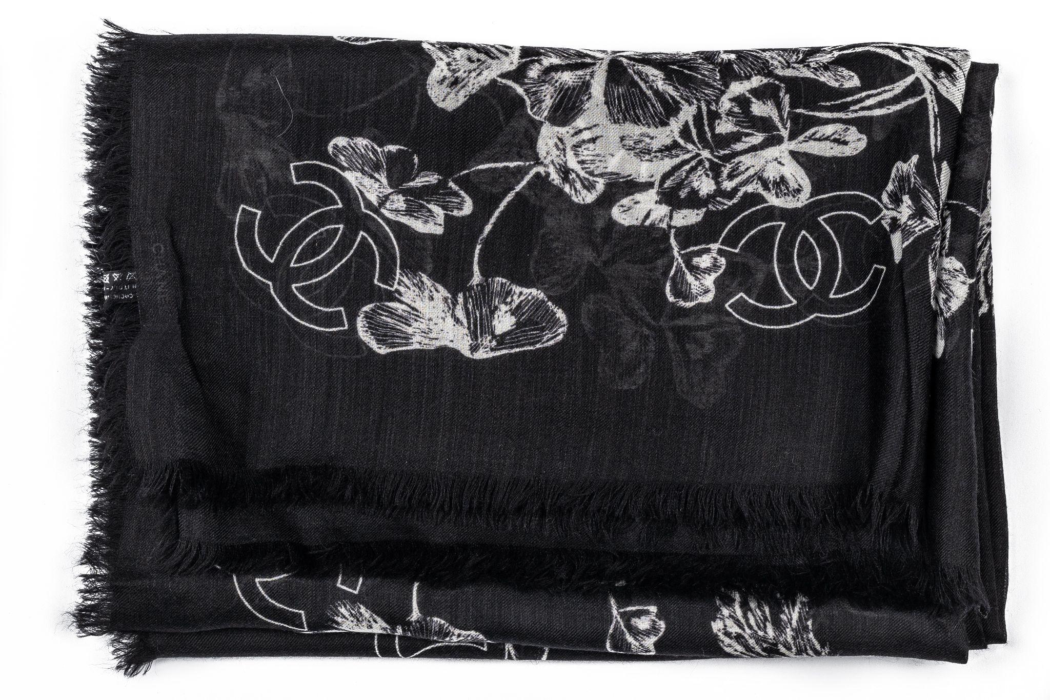 Chanel Cashmere Shawl in black with a frame featuring floral print. In new condition.