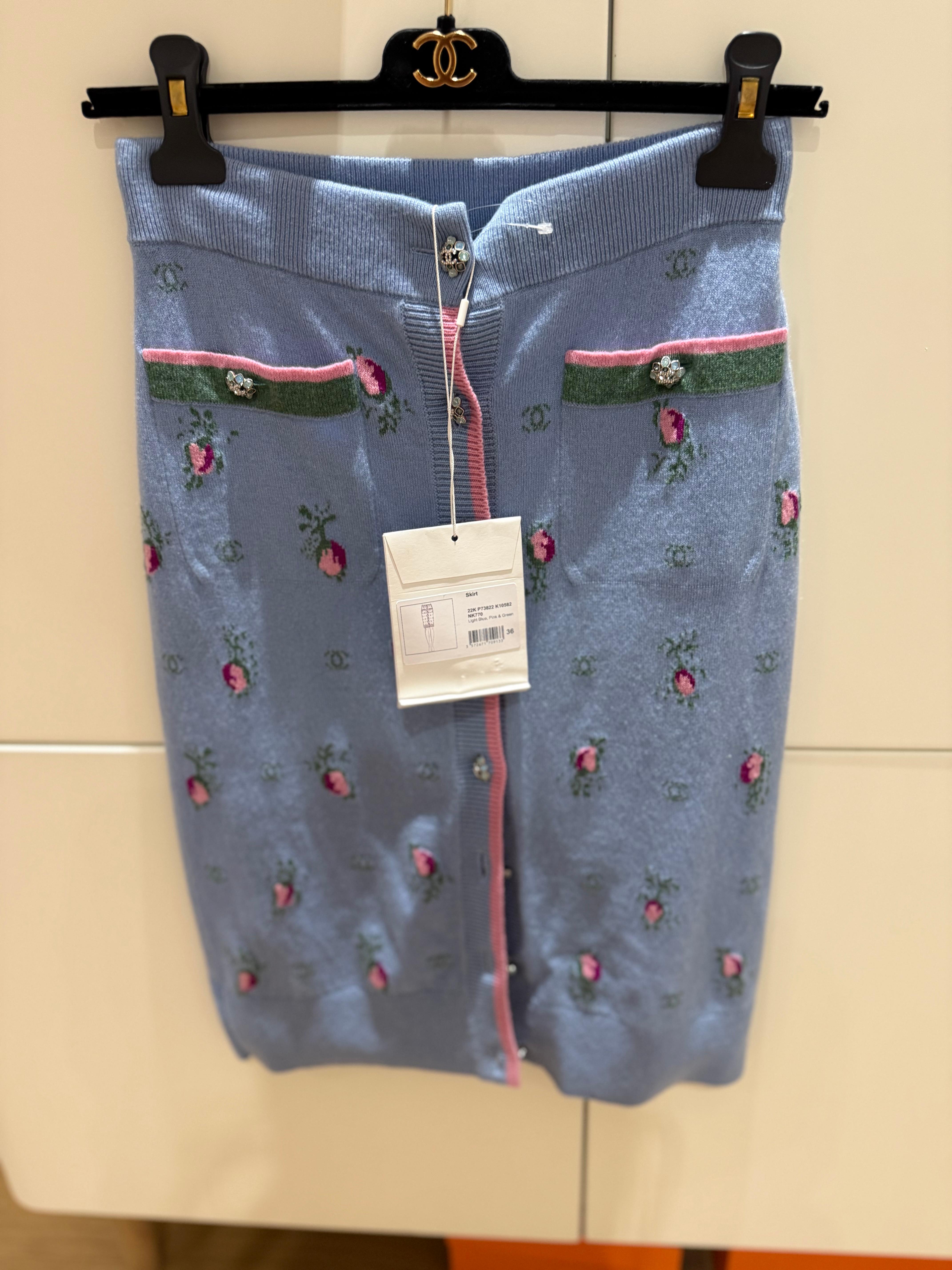 Chanel cashmere skirt in pastel blue, pink florals and green with crystal buttons. Size 36 French. It comes with tags on, chanel hanger and dustbag.

I have the matching sweater listed separately. 
