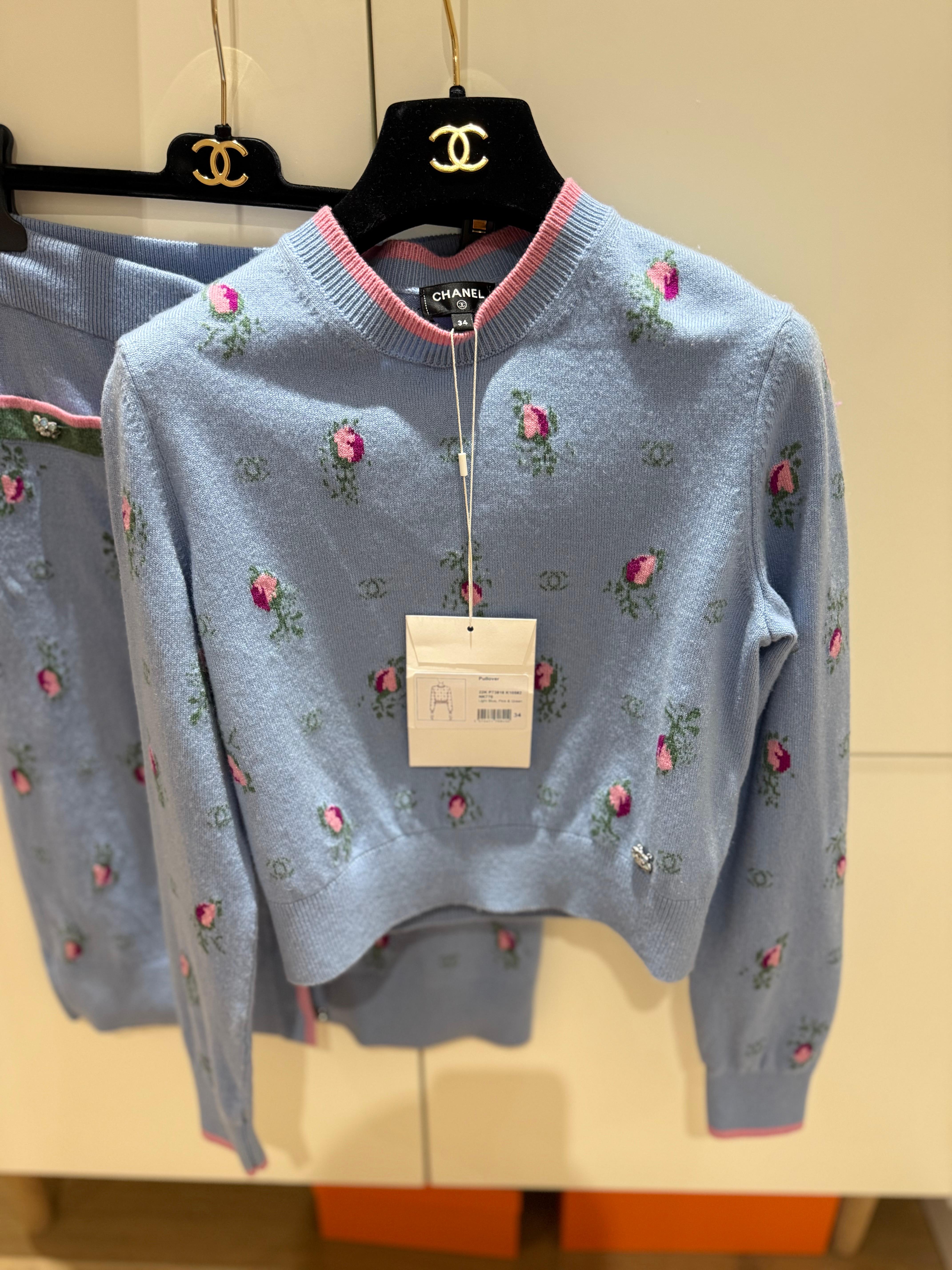 Chanel Cashmere blouse sweater in pastel blue, pink and green colour with floral pattern and crystal buttons. Size 34 French with tags on. Comes with hanger and a dustbag. 

I have the matching skirt listed separately, I can sell together. 