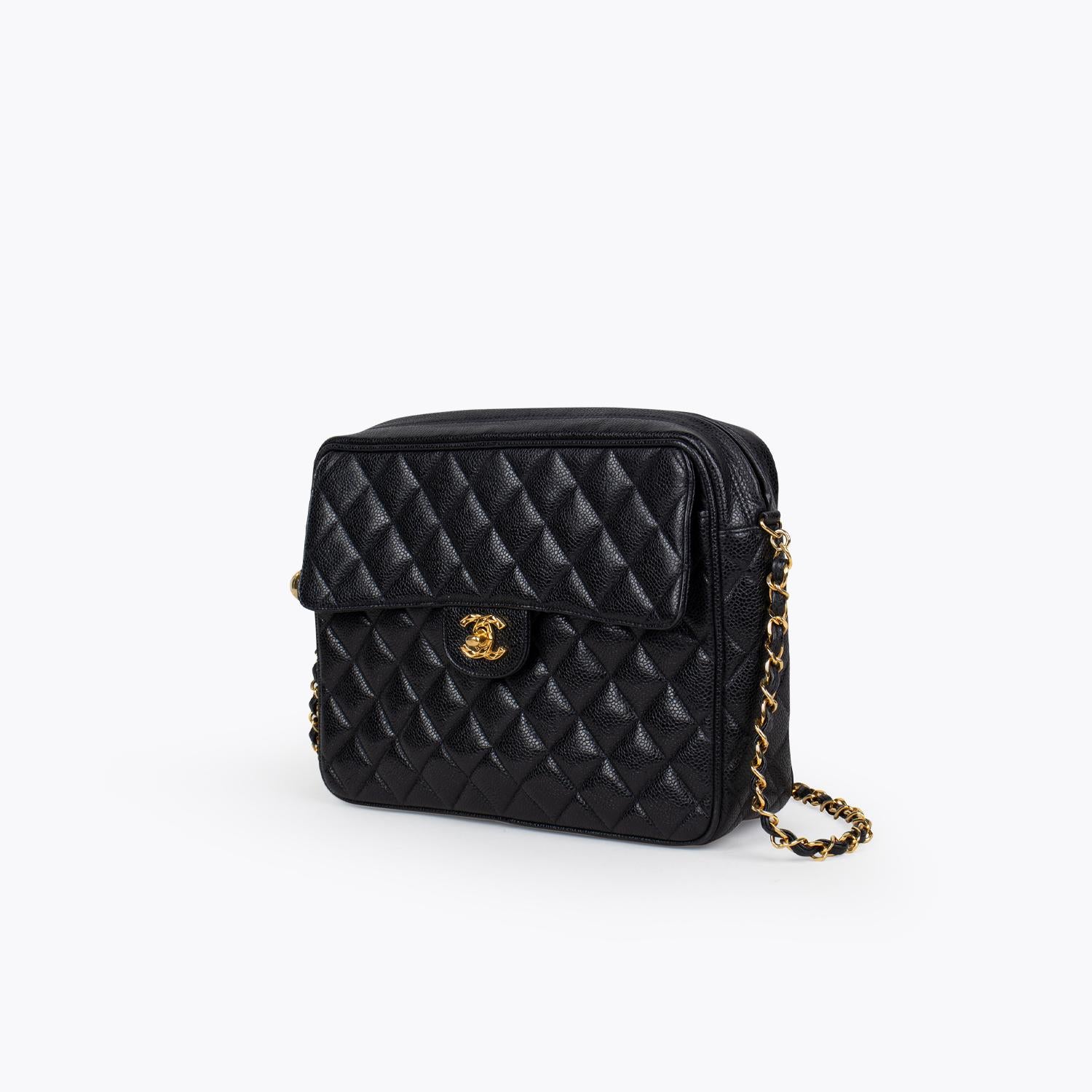 Black Caviar leather Chanel Camera crossbody bag with

- Gold-tone hardware
- Single chain-link shoulder strap
- Single exterior pocket at front featuring CC turn-lock closure
- Tonal leather lining, dual pockets at interior walls; one with zip