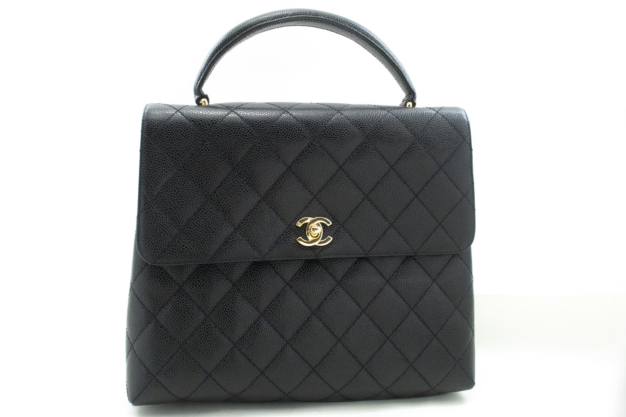 An authentic CHANEL Caviar Handbag Top Handle Bag Kelly Black Flap Leather Gold. The color is Black. The outside material is Leather. The pattern is Solid. This item is Vintage / Classic. The year of manufacture would be 2 0 0 2 .
Conditions &