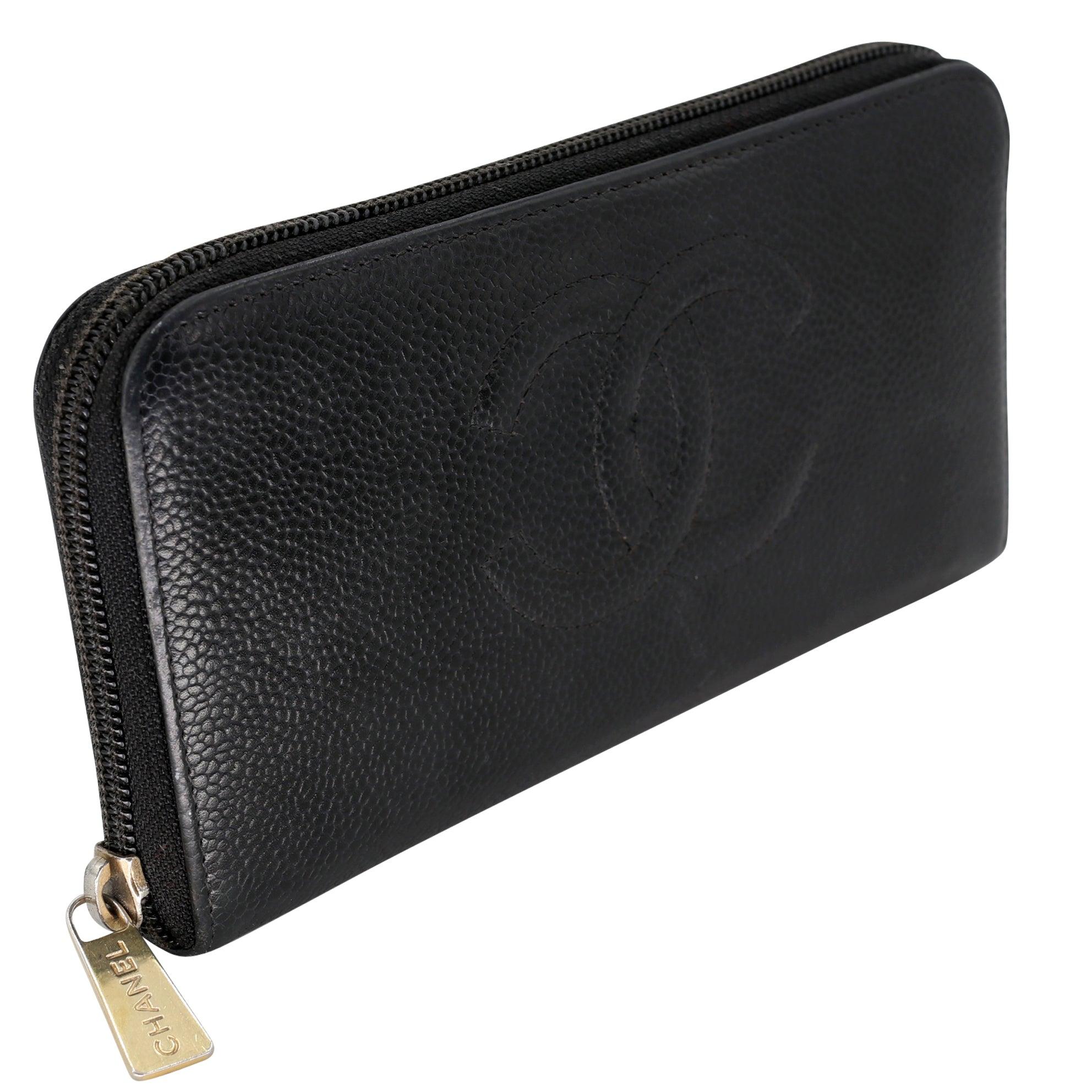 This Chanel Caviar Leather long wallet is perfect if you are seeking something chic and luxurious to organize your essentials such as bills, credit cards and coins. It features gorgeous black grain leather with a full zip around closure and the